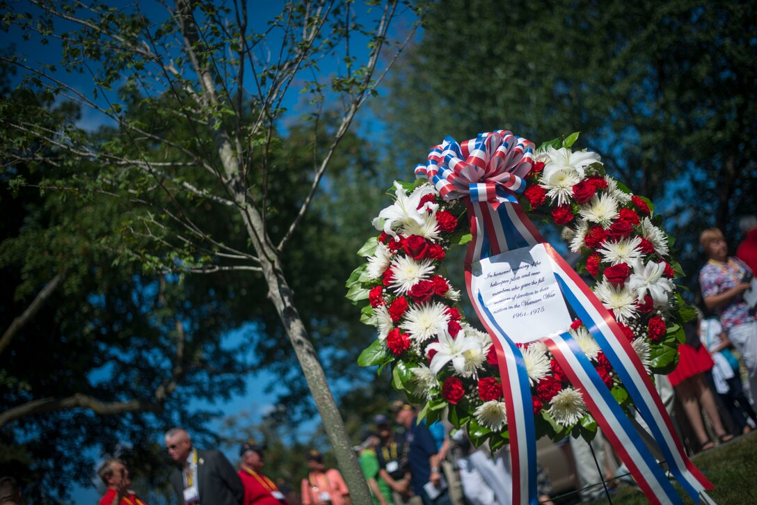 A wreath lies next to a maple tree at the Vietnam War Pilots and Aircrew Memorial Tree Dedication on Arlington National Cemetery, Va., Aug. 28, 2015. The Memorial service was hosted by the Vietnam Helicopter Pilots Association and honored the thousands of men and women who perished during the "Helicopter War." (U.S. Air Force photo by Staff Sgt. Chad C. Strohmeyer) (Released)