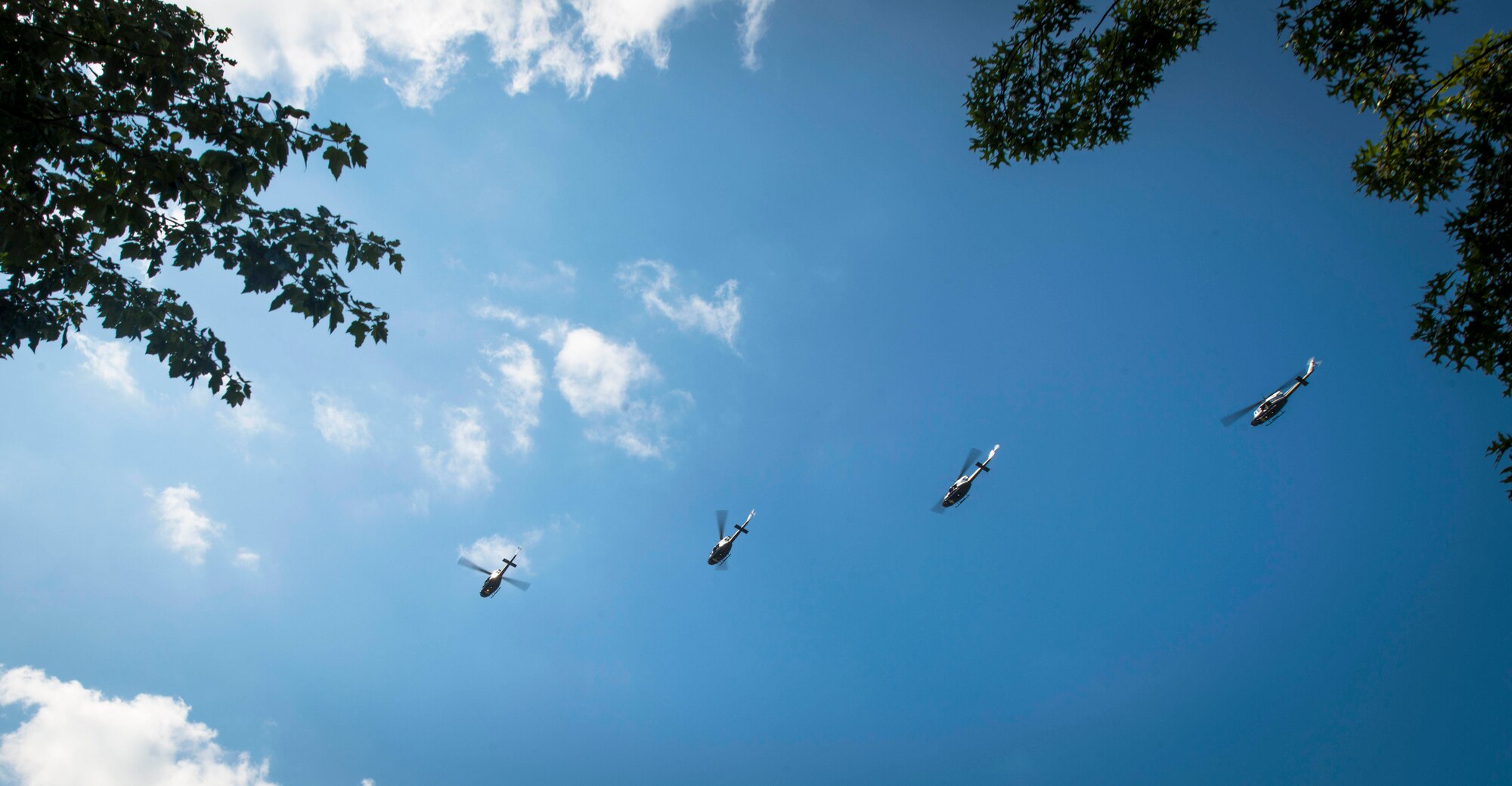 Four UH-1N helicopters from the 1st Helicopter Squadron fly in formation over Arlington National Cemetery, Va., Aug. 28, 2015. The fly-over was held to honor those who perished in helicopters during the Vietnam War. (U.S. Air Force photo by Staff Sgt. Chad C. Strohmeyer) (Released)