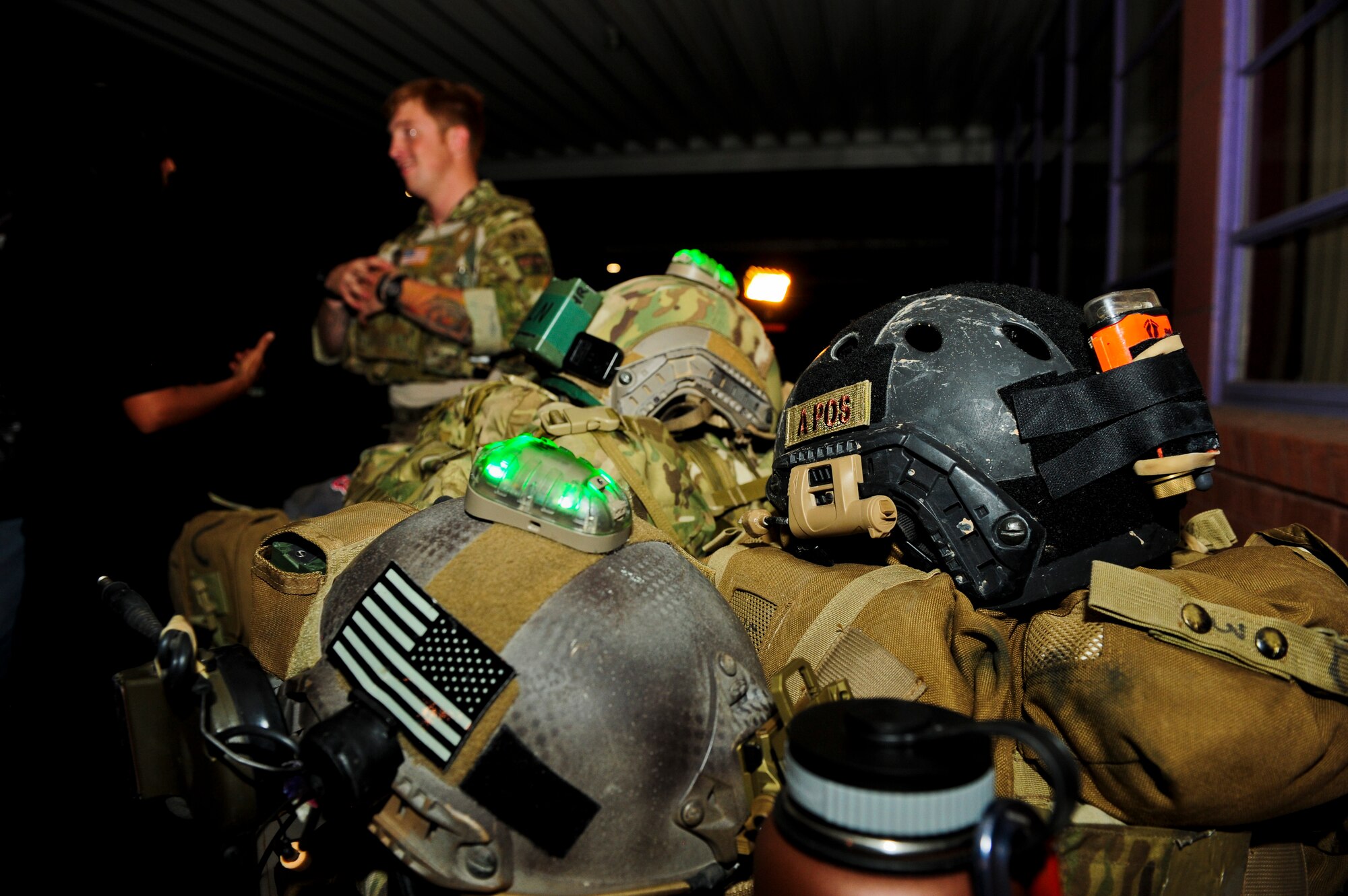 Tactical gear belonging to the 48th Rescue Squadron is displayed during a Meet and Greet event at Rincon High School, Tucson, Ariz., Aug. 26, 2015. Organizations from Davis-Monthan Air Force Base provided many types of equipment for attendees to interact with, to include a security forces battering ram trainer and an advanced medical patient simulator. (U.S. Air Force photo by Airman 1st Class Chris Drzazgowski/Released) 