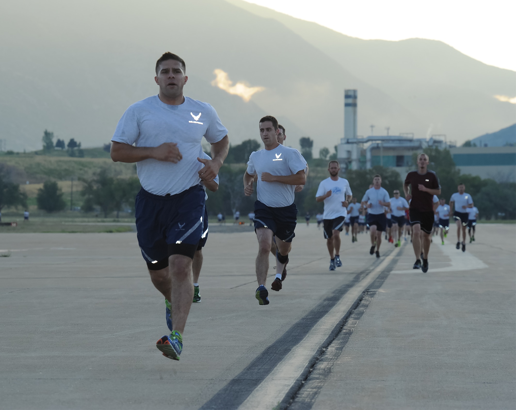 Airmen sprint the final section of a flightline run Thursday, Aug. 27, 2015, at Hill Air Force Base. Scheduled Team Hill Flightline Runs begin in the spring and end in the fall. All Team Hill units and organizations are welcome to participate in the two-mile, noncompetitive runs. (U.S. Air Force photo by R, Nial Bradshaw/Released)