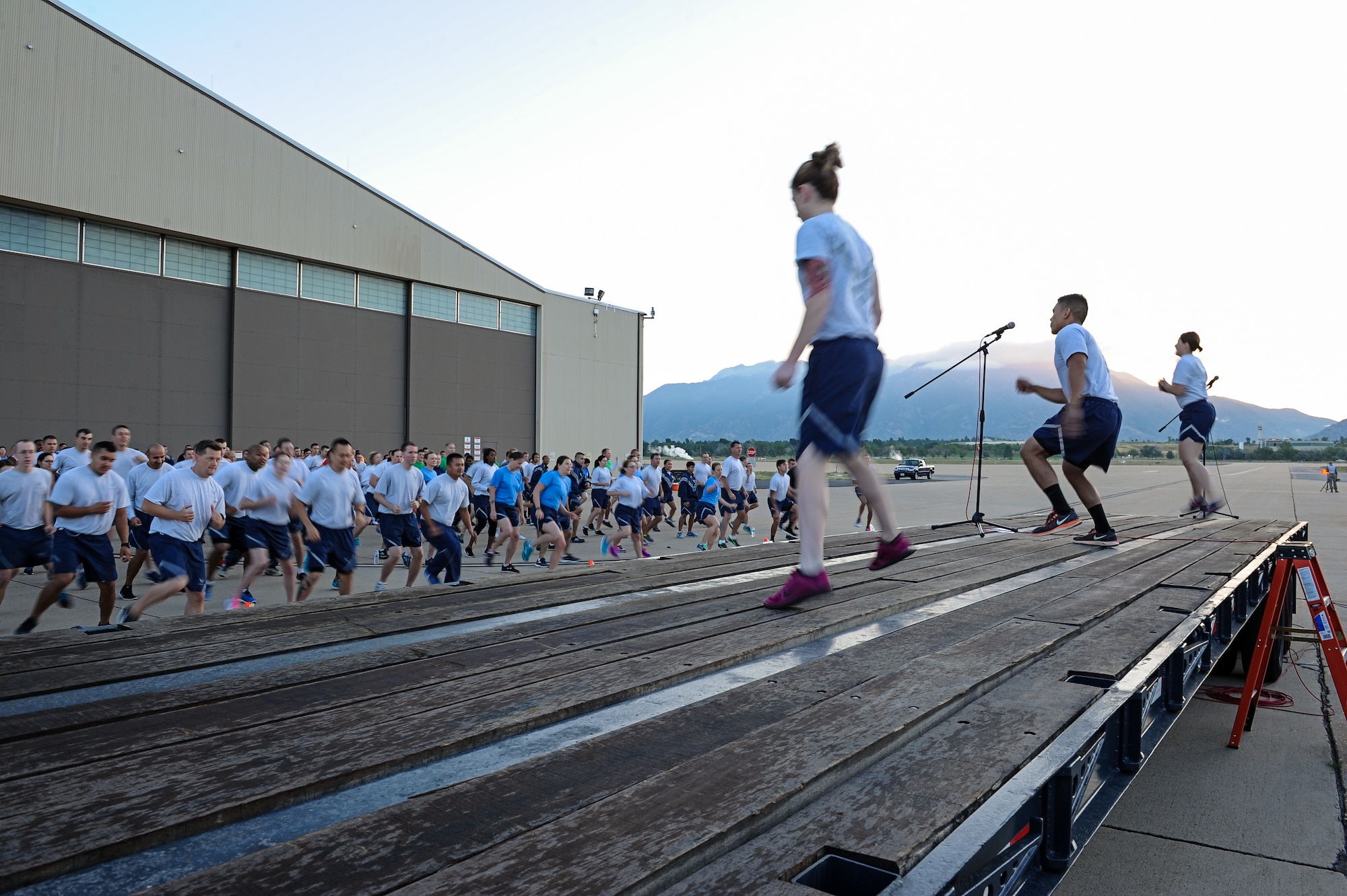 Airmen warm up prior to a Team Hill Flightline Run Thursday, Aug. 27, 2015, at Hill Air Force Base. The goal of the two-mile, self-paced run was to promote physical fitness and esprit de corps. The last flightline run of 2015 is scheduled for Sept. 24. (U.S. Air Force photo by R. Nial Bradshaw/Released)