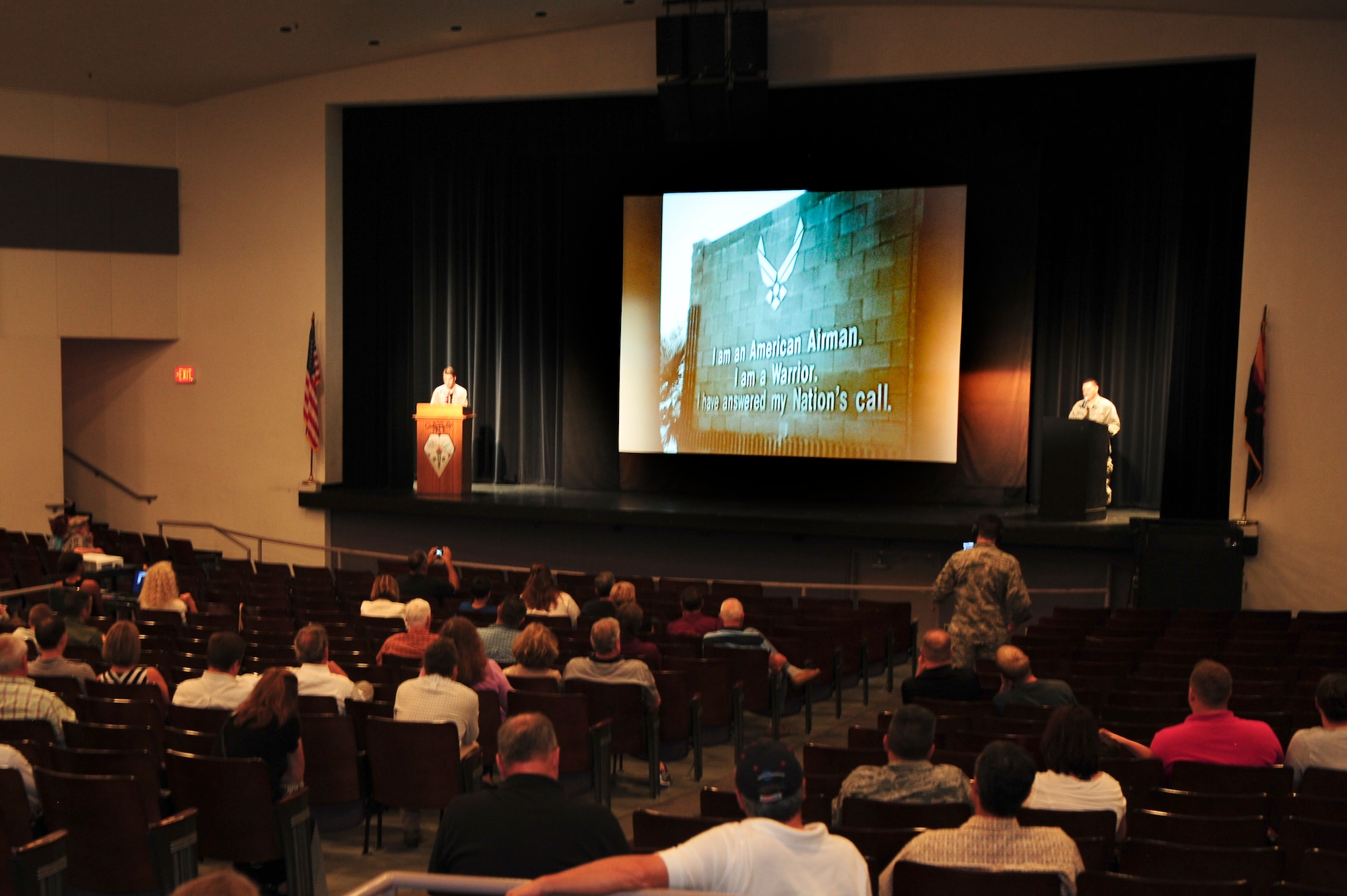 U.S. Air Force Airmen from Davis-Monthan Air Force Base narrate a mission brief to local residents during a Meet and Greet event at Rincon High School, Tucson, Ariz., Aug. 26, 2015. The Meet and Greet event allowed members of the Tucson community to interact with their neighboring Airmen and learn more about the mission of Davis-Monthan Air Force Base. (U.S. Air Force photo by Airman 1st Class Chris Drzazgowski/Released) 