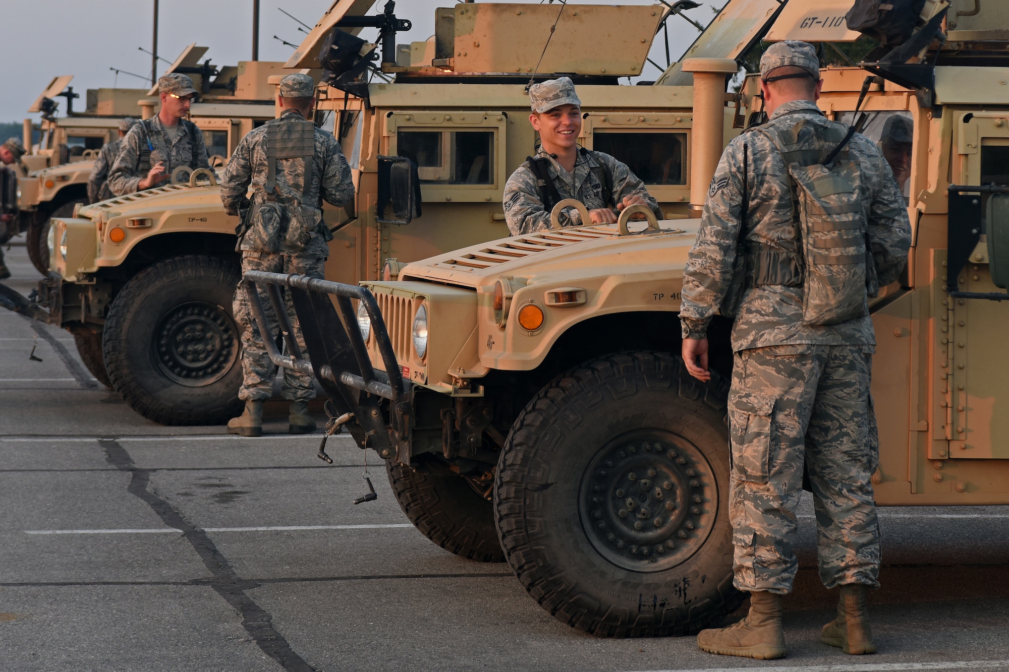 U.S. Airmen with the 121st Security Forces Squadron inspect their vehicles before departing for Camp Grayling Joint Maneuver Training Center, Mich. Aug. 17, 2015. The Airmen spent three days at Camp Grayling in a simulated deployed environment as a part of their annual training. (U.S. Air National Guard photo by Airman Ashley Williams/Released)