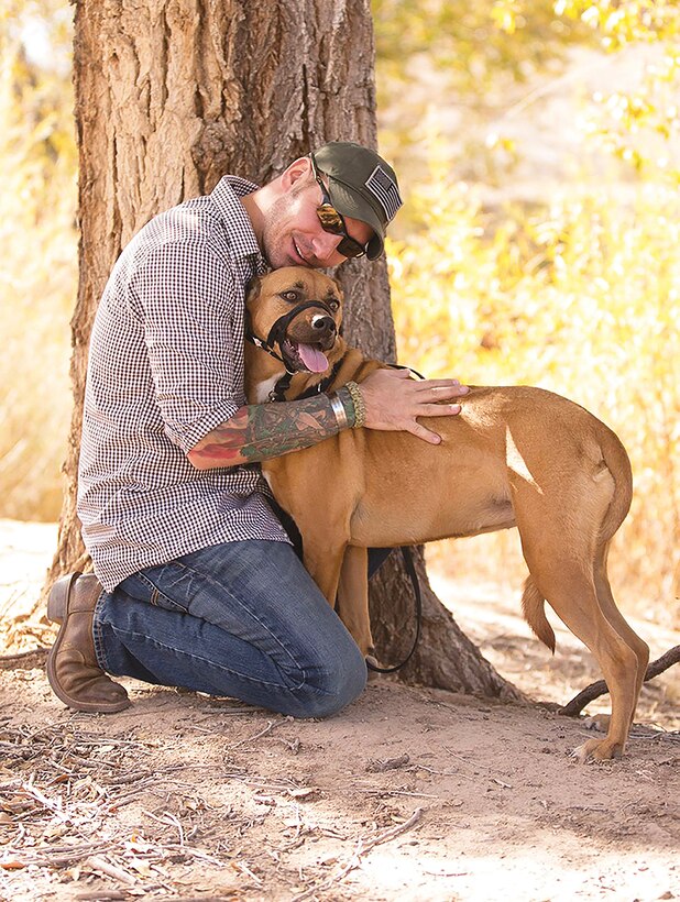 Rob Mitchell with his service dog, Hunni. For the first time, Sandia National
Laboratories has welcomed a service dog to its New Mexico campus as a workplace accommodation for a veteran living with post-traumatic stress disorder. (Courtesy photo)