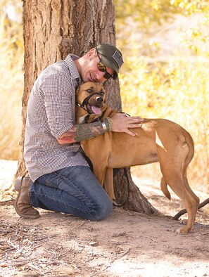 Rob Mitchell with his service dog, Hunni. For the first time, Sandia National
Laboratories has welcomed a service dog to its New Mexico campus as a workplace accommodation for a veteran living with post-traumatic stress disorder. (Courtesy photo)