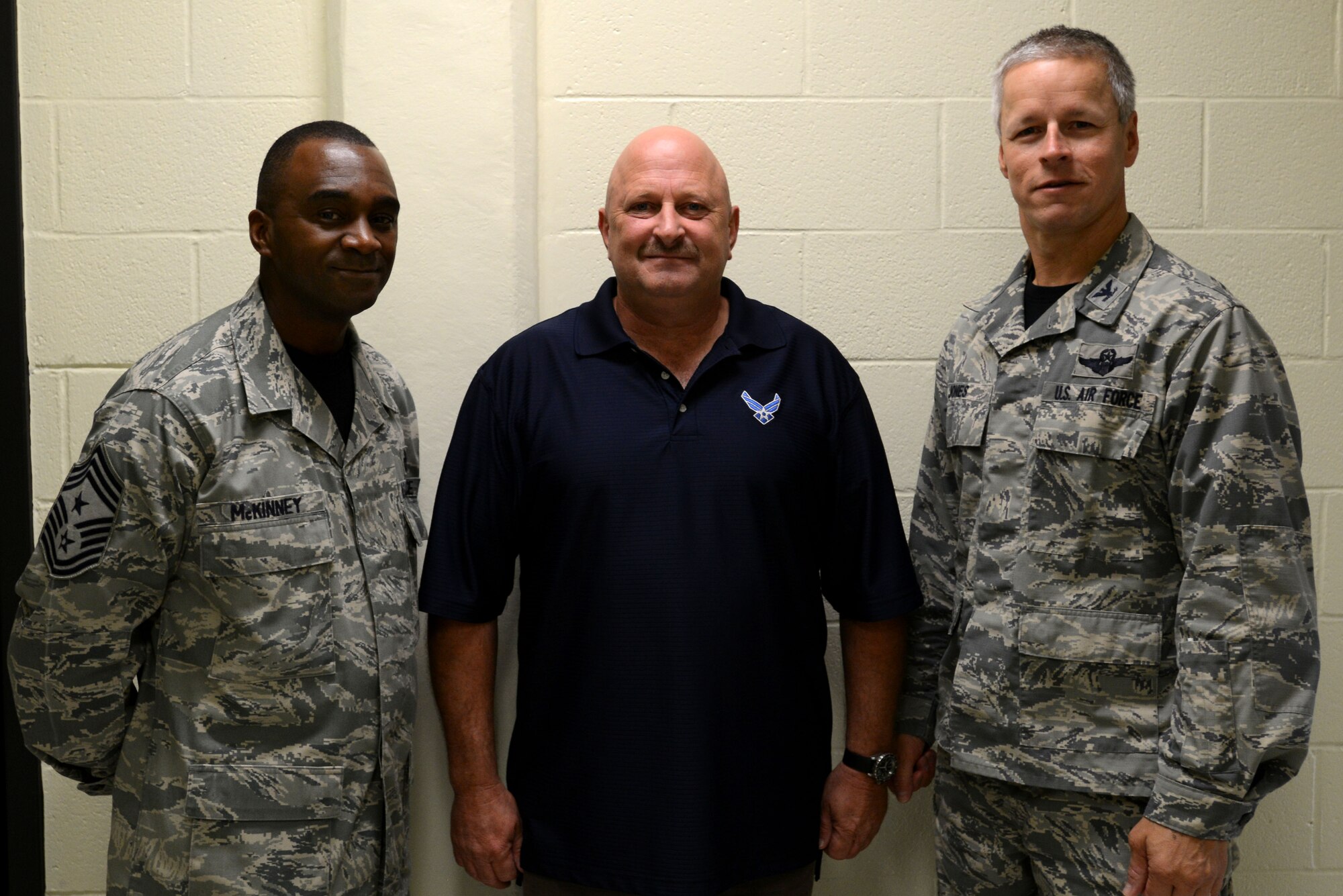 Robert Healy, 20th Security Forces Squadron civilian contractor, is recognized by Chief Master Sgt. Christopher McKinney, 20th Fighter Wing command chief, and Col. William Jones, 20th FW vice commander, for his actions in accordance with the “See something? Say something!” campaign at Shaw Air Force Base, S.C., Aug. 28, 2015. Upon hearing about the suspicious comments made by a fuel delivery driver, Healy assessed that the comments were a concern and contacted the driver’s employer to assure that he would no longer be making deliveries to Shaw. (U.S. Air Force photo by Airman 1st Class Kelsey Tucker/Released)