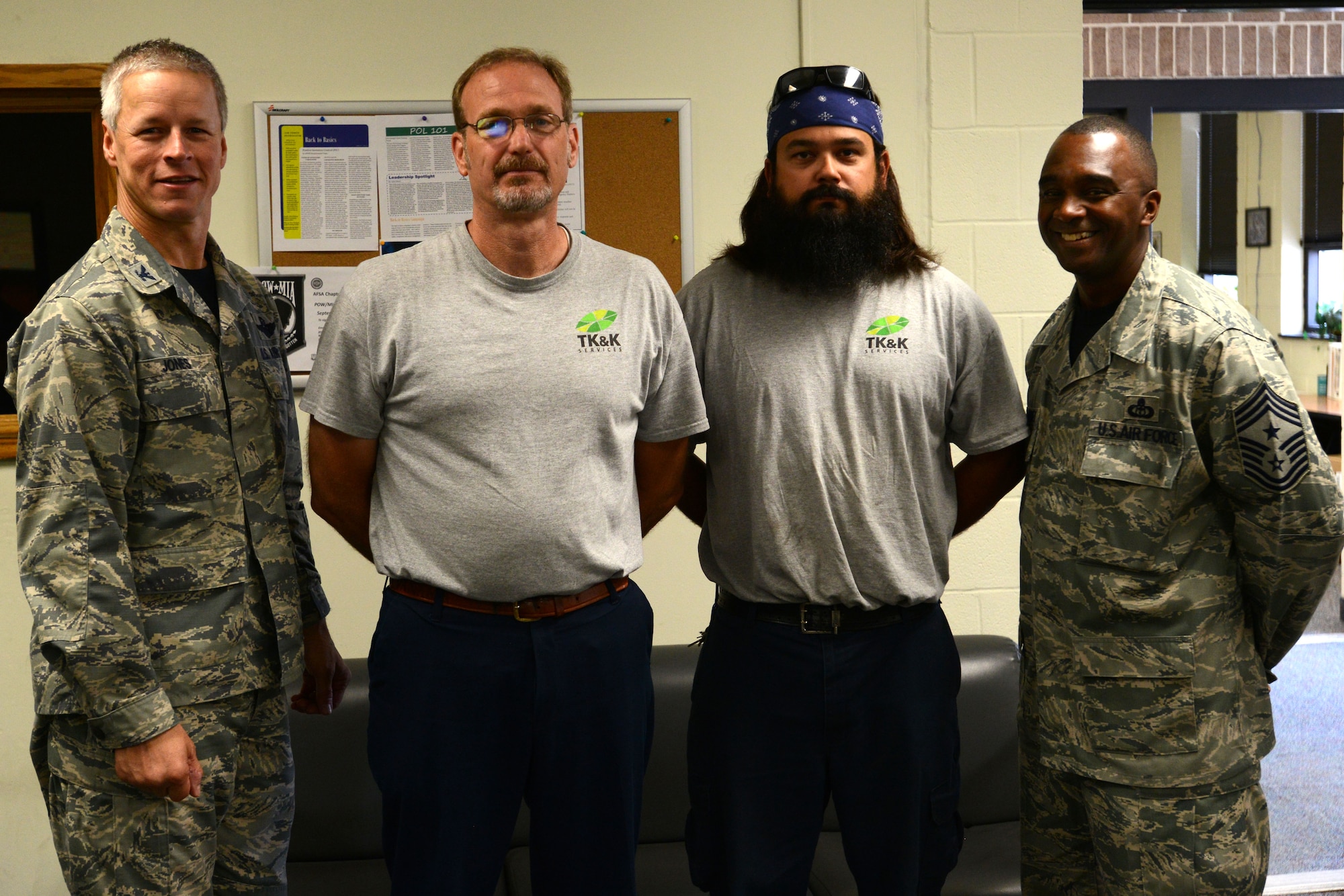 Paul Kipp and Adam Anderson, 20th Logistics Readiness Squadron fuels contractors, are recognized by Col. William Jones, 20th Fighter Wing vice commander, and Chief Master Sgt. Christopher McKinney, 20th FW command chief, for their actions in accordance with the “See something? Say something!” campaign at Shaw Air Force Base, S.C., Aug. 28, 2015. Kipp and Anderson raised their concerns about a fuel delivery driver who had made suspicious and alarming comments while conversing, which led to the driver being banned from delivering to Shaw. (U.S. Air Force photo by Airman 1st Class Kelsey Tucker/Released)