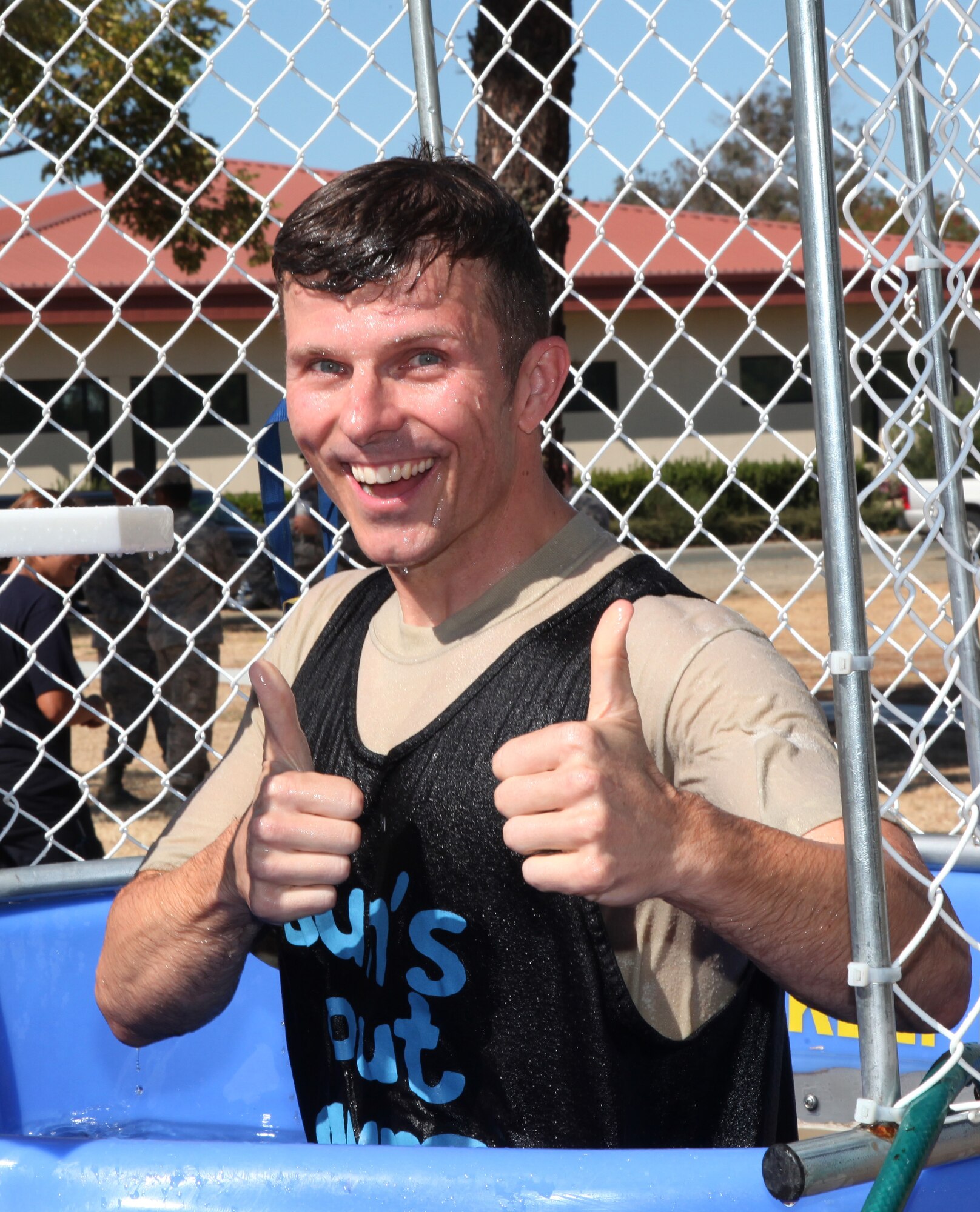 TRAVIS AIR FORCE BASE, Calif. -- Leaders from the 349th Air Mobility Wing took turns in the dunk tank Aug. 22, 2015 at Travis Air Force Base, Cailf., to promote esprit de corps and raise money for Airmen recognition activities.  (U.S. Air Force photo/Lt. Col. Robert Couse-Baker)