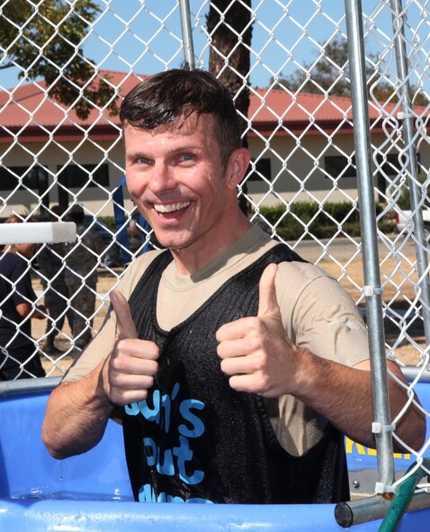 TRAVIS AIR FORCE BASE, Calif. -- Leaders from the 349th Air Mobility Wing took turns in the dunk tank Aug. 22, 2015 at Travis Air Force Base, Cailf., to promote esprit de corps and raise money for Airmen recognition activities.  (U.S. Air Force photo/Lt. Col. Robert Couse-Baker)