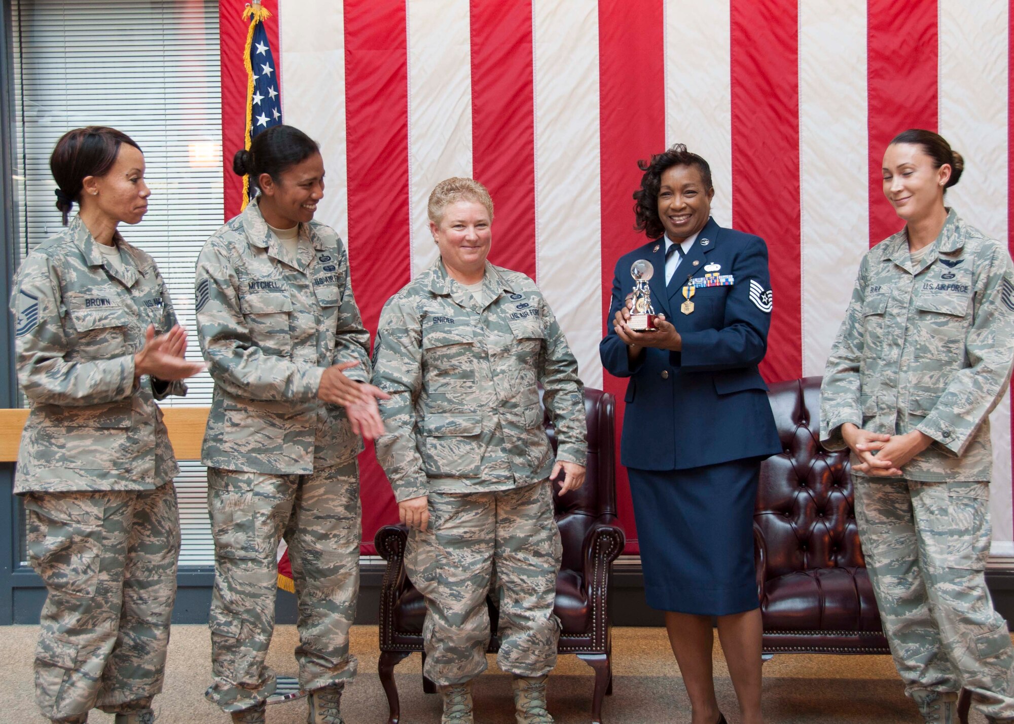 TRAVIS AIR FORCE BASE, Calif. -- Tech. Sgt. April Cofield, maintenance training manager, with the 349th Maintenance Group, retired after 21 years of military service, August 22, 2015. (U.S. Air Force photo/Staff Sgt. Cindy G. Alejandrez)