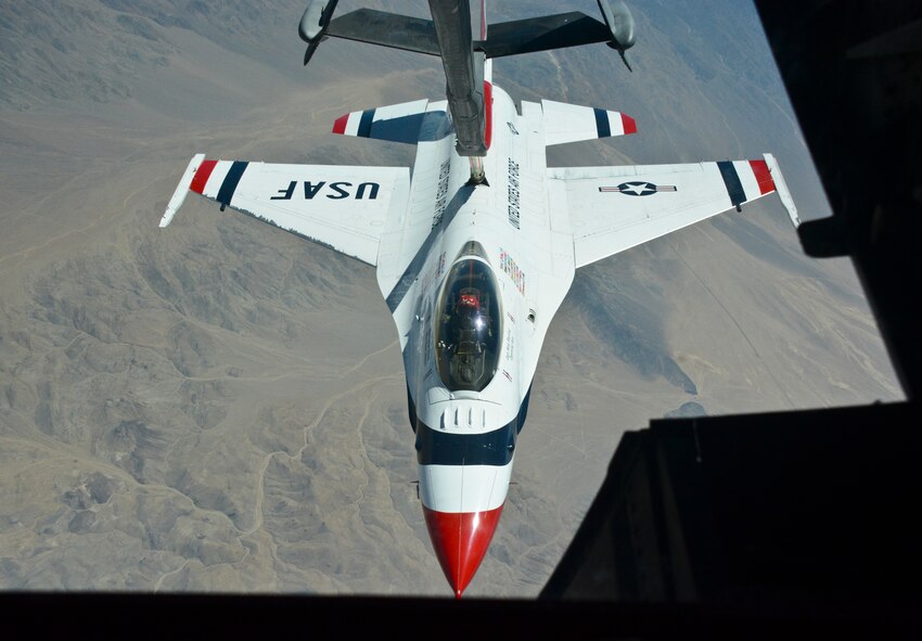 A Thunderbird is refueled over Nevada by a KC-10 Extender from Travis Air Force Base, Calif. The Thunderbirds were preparing for the Aviation Roundup Airshow in Minden, Nev. (U.S. Air Force photo by Airman 1st Class Amber Carter)