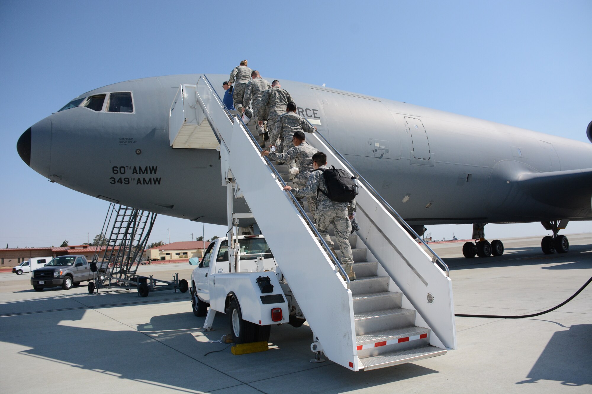 Airmen board a KC-10 Extender Aug. 20 at Travis Air Force Base, Calif. The outstanding performers were given the opportunity to witness an in-air refuel of the United States Air Force Thunderbirds. (U.S. Air Force photo by Airman 1st Class Amber Carter)