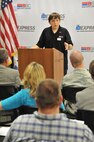 Tray Cook, who was born with vision disabilities, speaks during the Ability One Base Supply Program 20th anniversary ceremony Aug. 26, 2015, at Malmstrom Air Force Base, Mont. The Ability One program is the single largest source of jobs for individuals who are blind or have significant disabilities in the United States. (U.S. Air Force photo/John Turner)