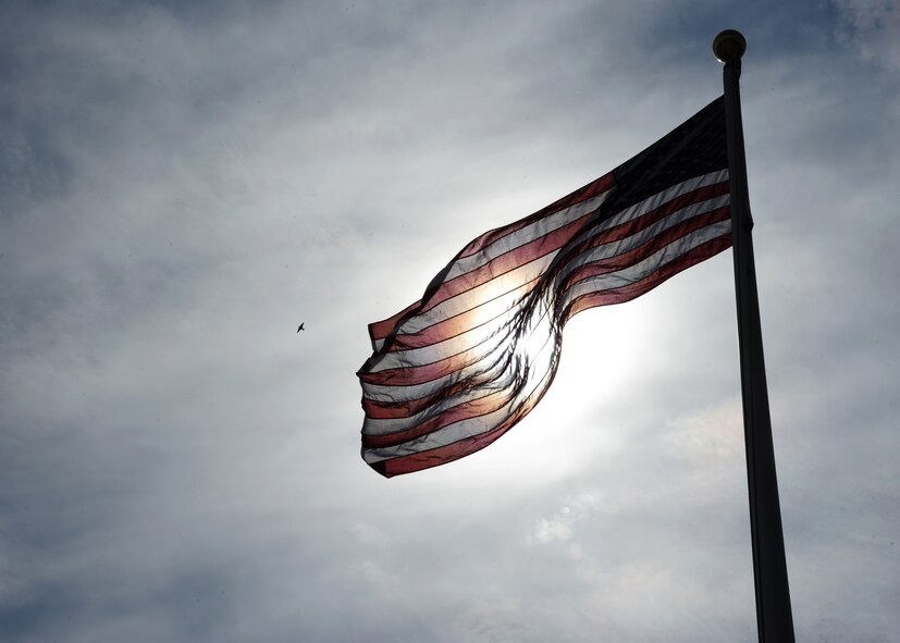The American Flag waves in the wind August 19, 2015, on Grand Forks Air Force Base, North Dakota. The flag is raised and lowered to symbolize the beginning and end to the duty day. (U.S. Air Force photo by Airman 1st Class Ryan Sparks/Released)