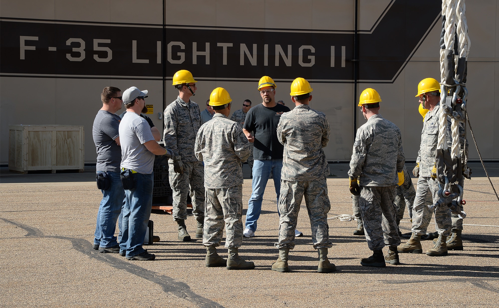 Jamie Sobota, an aircraft maintainer assigned to the 421st Maintenance Squadron, Edwards Air Force Base, Calif., briefs Airmen assigned to the 388th Equipment Maintenance Squadron, Hill AFB, Utah, on Crash Damaged Disabled Aircraft Recovery Program procedures at Hill AFB, Thursday, August 27, 2015. CDDARP training ensures Hill Airmen are prepared for the base’s future operational F-35 mission. Firefighters and explosive ordnance disposal personnel also participated in the training. (U.S. Air Force photo by R. Nial Bradshaw/Released)