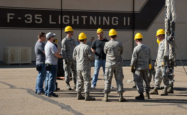 Jamie Sobota, an aircraft maintainer assigned to the 421st Maintenance Squadron, Edwards Air Force Base, Calif., briefs Airmen assigned to the 388th Equipment Maintenance Squadron, Hill AFB, Utah, on Crash Damaged Disabled Aircraft Recovery Program procedures at Hill AFB, Thursday, August 27, 2015. CDDARP training ensures Hill Airmen are prepared for the base’s future operational F-35 mission. Firefighters and explosive ordnance disposal personnel also participated in the training. (U.S. Air Force photo by R. Nial Bradshaw/Released)