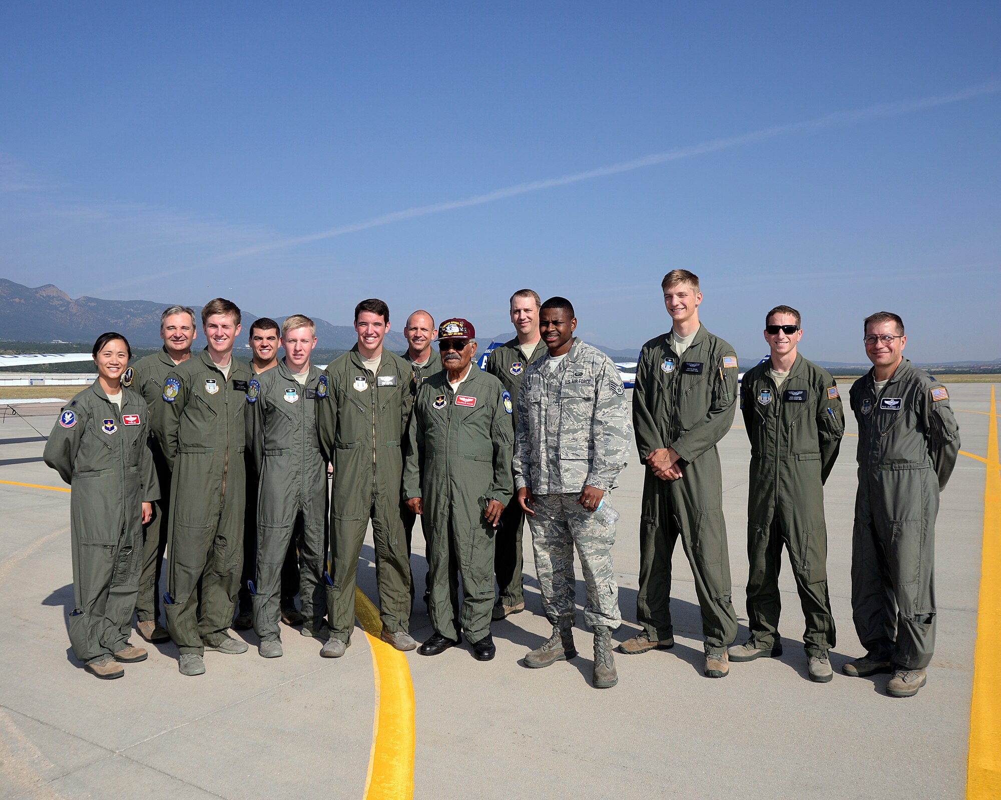 Original Tuskegee Airman Franklin Macon stands with members of the U.S. Air Force Academy cadet flying team and airfield personnel after flying in a T-41 August 25, 2015. Macon took his first powered flight at the airfield when it was only a dirt strip. (U.S. Air Force photo /Mike Kaplan)