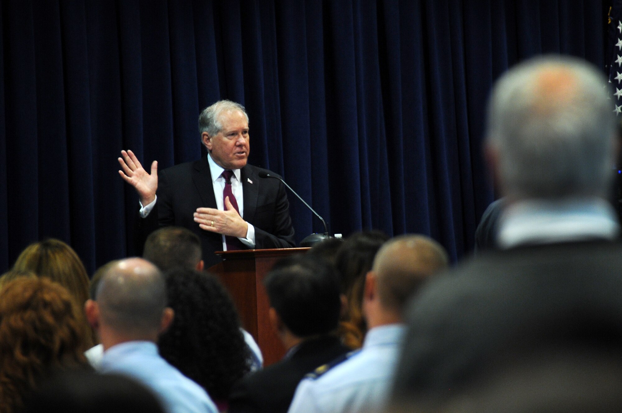 Frank Kendall, undersecretary of Defense for Acquisition, Technology and Logistics, speaks before a packed audience of several hundred from Directorates and Divisions of the Space and Missile Systems Center during an “All Call” held Aug. 27 in the Gordon Conference Center at the Space and Missile Systems Center's Schriever Space Complex, Los Angeles Air Force Base in El Segundo, Calif.  (U.S. Air Force photo/Van Ha)