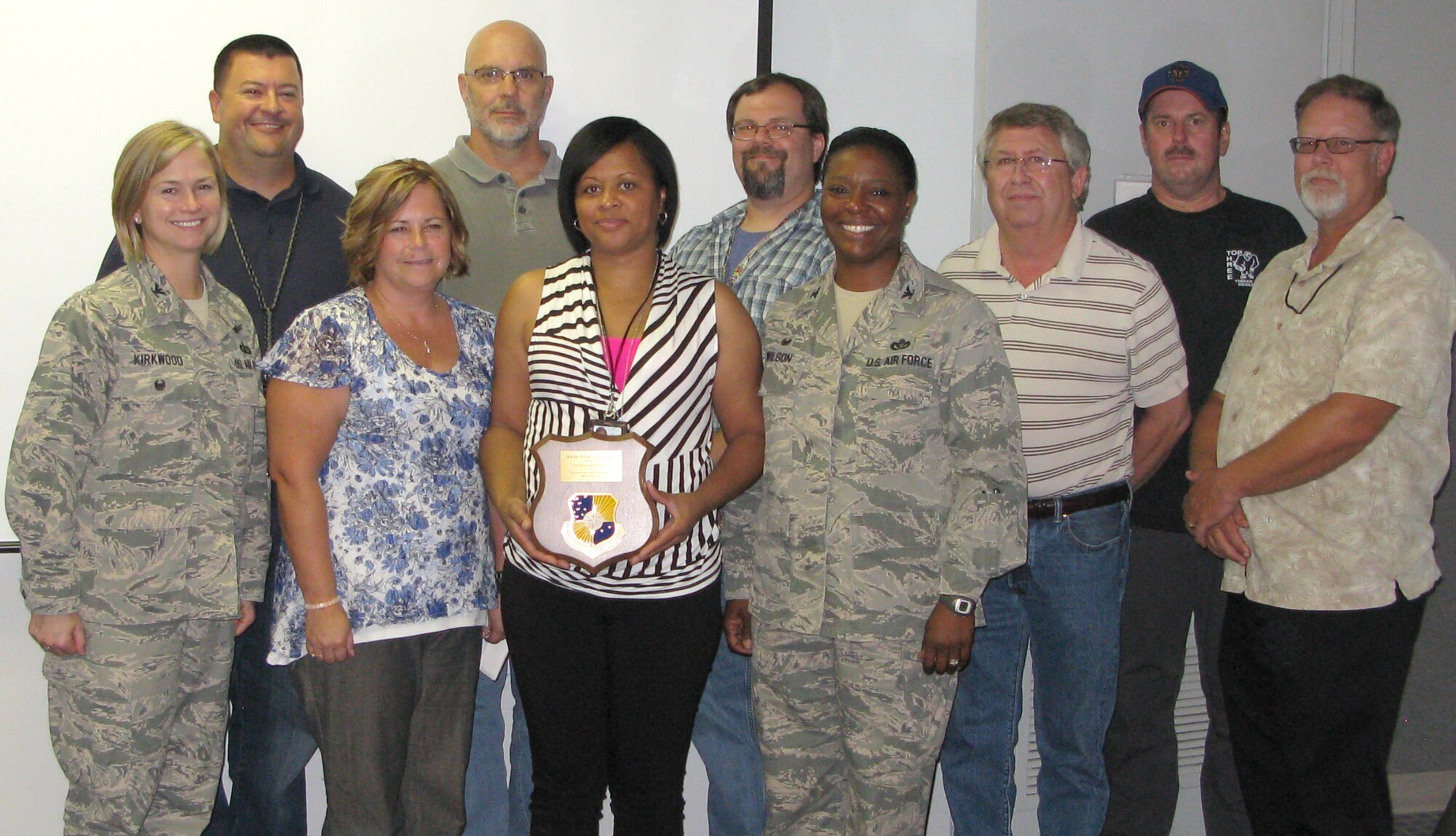 The 72nd Air Base Wing Communications Directorate’s Records Relocation Team was recently honored with the 72nd ABW Wildcatter Award. Pictured are, from left, 72nd ABW Vice Commander Col. Lea Kirkwood, Mike Wiles, Joyce Lockcuff, Bobby Bolf, Karla Wells, Jake Langham, 72nd ABW Commander Col. Stephanie Wilson, Mark Holder, Greg Lewis and Russell Laverty. (Courtesy photo/Released)