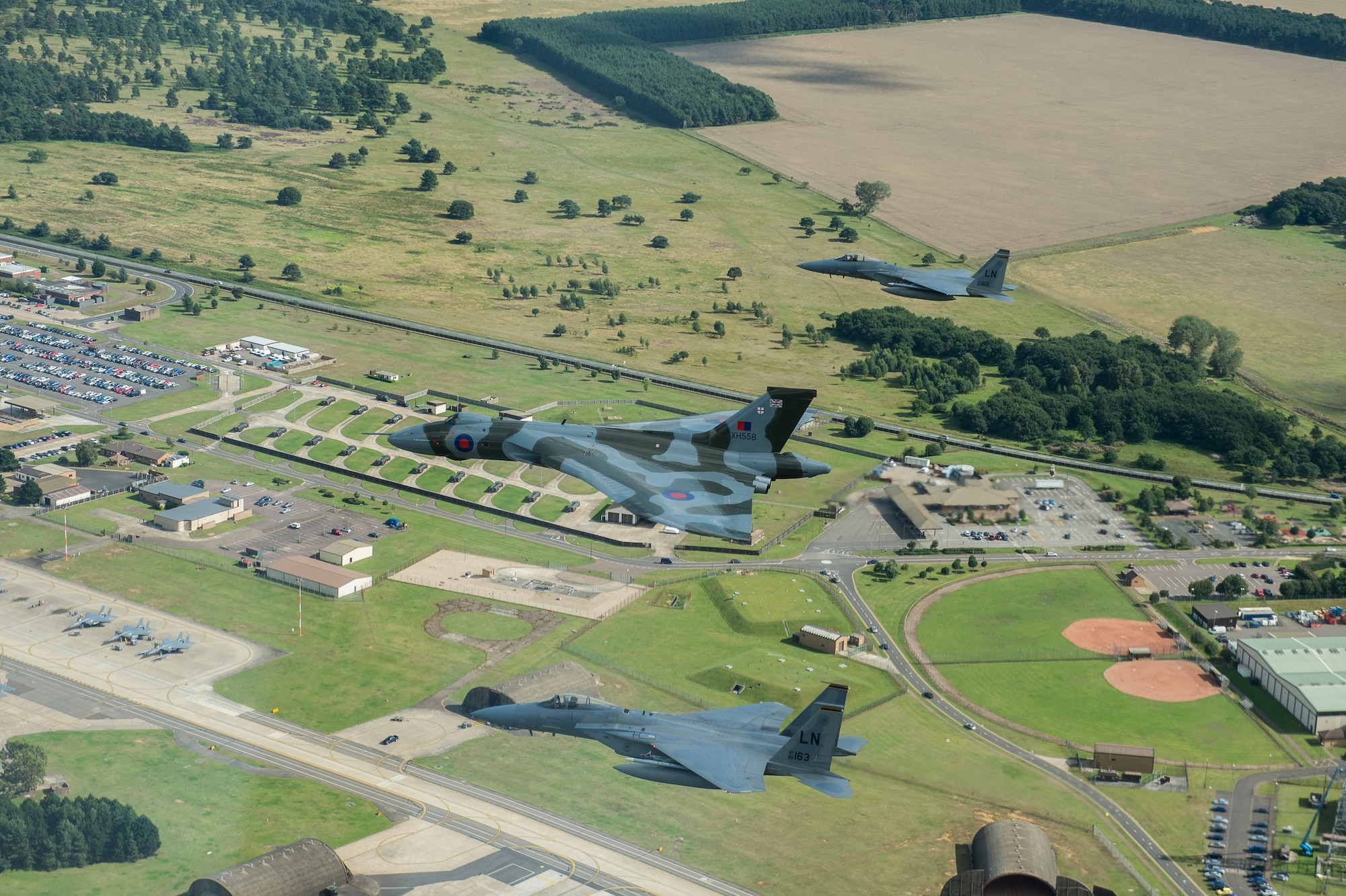 The Avro Vulcan XH558, accompanied by an F-15C Eagle assigned to the 48th Fighter Wing, flyover Royal Air Force Lakenheath, England, Aug. 27, 2015 during a fly over event. This historic event marks the first and last time these aircraft will ever fly together. This particular Vulcan was the first one to be delivered to the RAF and now the last complete Vulcan in the world. (U.S. Air Force photo/Senior Airman Trevor T. McBride/Released)