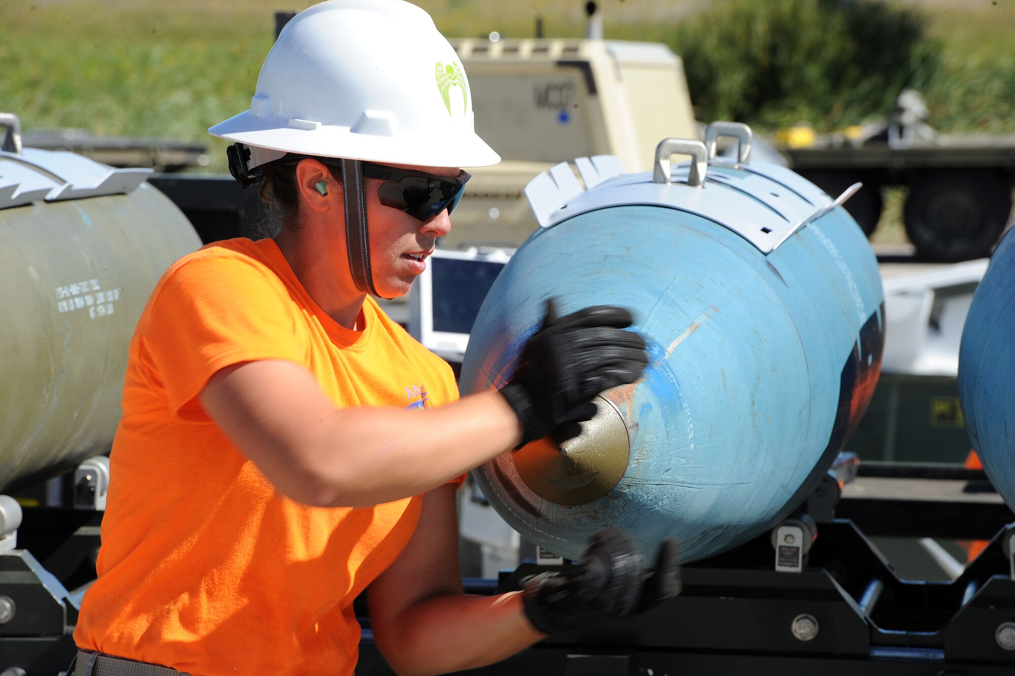 Staff Sgt. Amber Stepan installs a nose plug on a 2000 pound bomb body at Minot Air Force Base, N.D., Aug. 24, 2015. Stepan is part of the 5th Munitions Squadron Global Strike Challenge team that will compete at Barksdale Air Force Base, LA. (U.S. Air Force photo / Senior Airman Kristoffer Kaubisch)