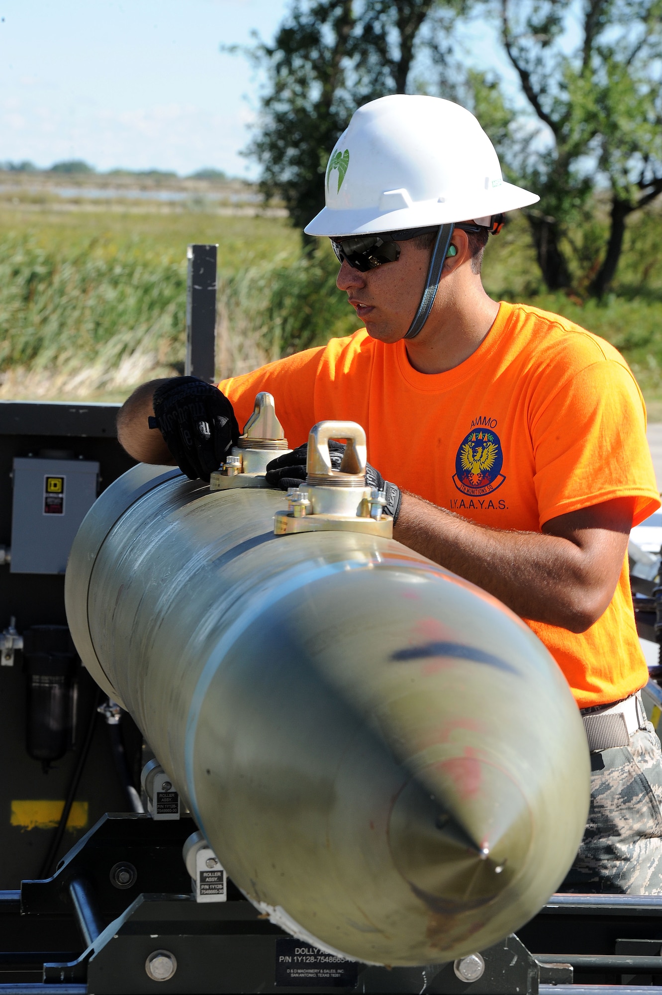 Senior Airman Kody Regelbrugge installs lug sleeve bolts for the 2000 pound bomb body at Minot Air Force Base, N.D., Aug. 24, 2015. Regelbrugge is part of the 5th Munitions Squadron Global Strike Challenge team that will compete at Barksdale Air Force Base, LA. (U.S. Air Force photo / Senior Airman Kristoffer Kaubisch)