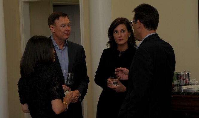 Washington Redskins Vice President of Marketing Rod Nenner, Air Force District of Washington Commander Maj. Gen. Darryl Burke and their guests Kimberlee DeWitt and Rebecca Nenner chat before dinner at the Burke residence on Joint Base Andrews, Md. August 27, 2015. The purpose of the AFDW Community Partnership Dinner is to inform, educate and raise awareness of the Air Force among distinguished civic leaders and their respective communities. (U.S. Air Force photo/Michael Martin)