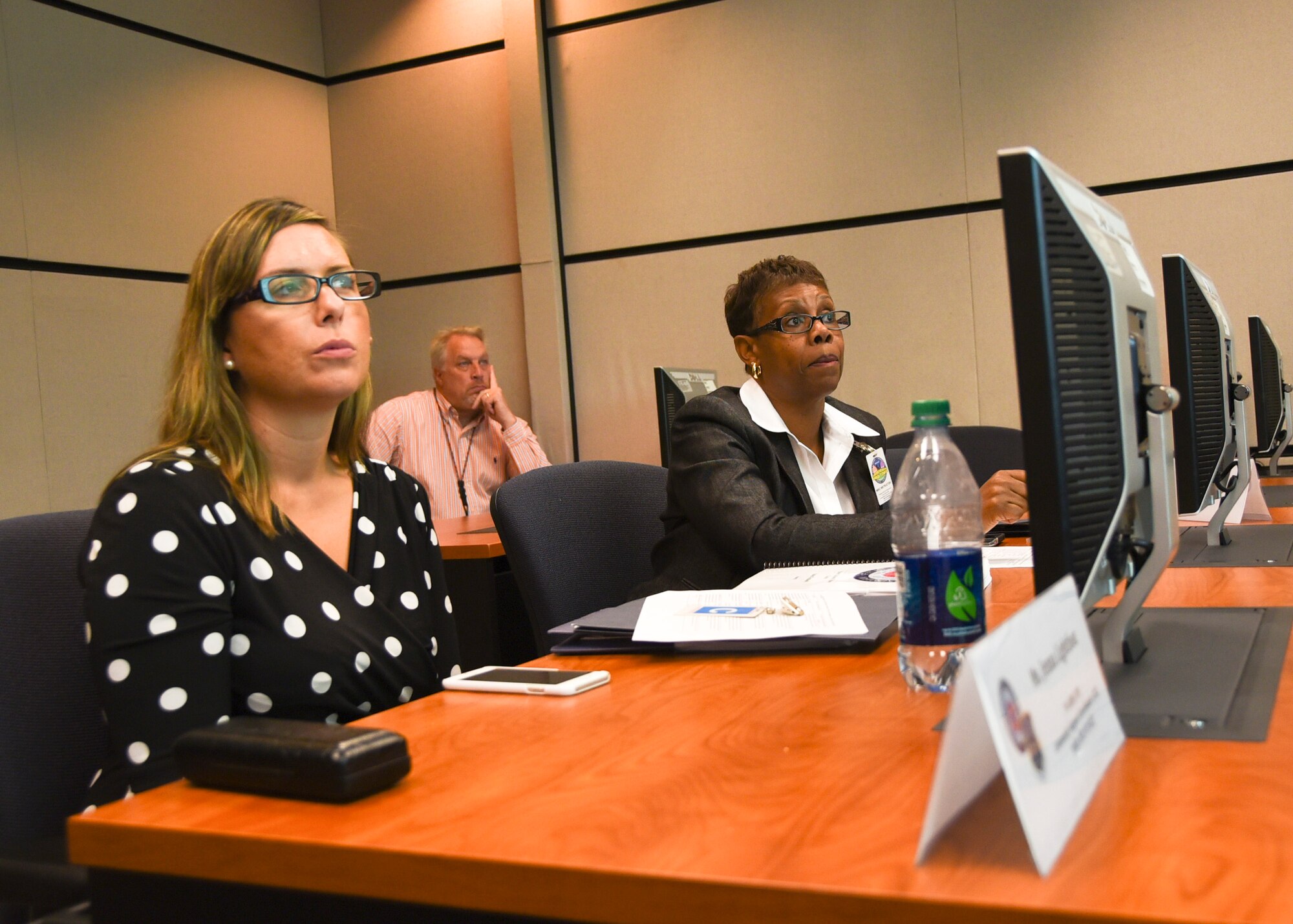 Members of the Instruction System Design review team listen during discussion about the Master Resilience Trainer Course curriculum at the U.S. Air Force Expeditionary Center, Aug. 13. The MRTC, taught at the U.S. Air Force Expeditionary Center, underwent an ISD review with credentialed Airmen whose professions align with the Comprehensive Airmen Fitness model of Mental, Physical, Social, and Spiritual domains. (U.S. Air Force photo/Bradley Camara)