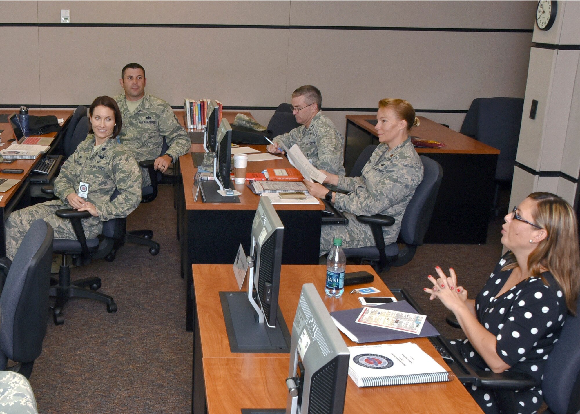 Members of the Instruction System Design review team discuss the Master Resilience Trainer Course curriculum at the U.S. Air Force Expeditionary Center, Aug. 13. The MRTC underwent an ISD review with credentialed Airmen whose professions align with the Comprehensive Airmen Fitness model of Mental, Physical, Social, and Spiritual domains. (U.S. Air Force photo/Bradley Camara)
