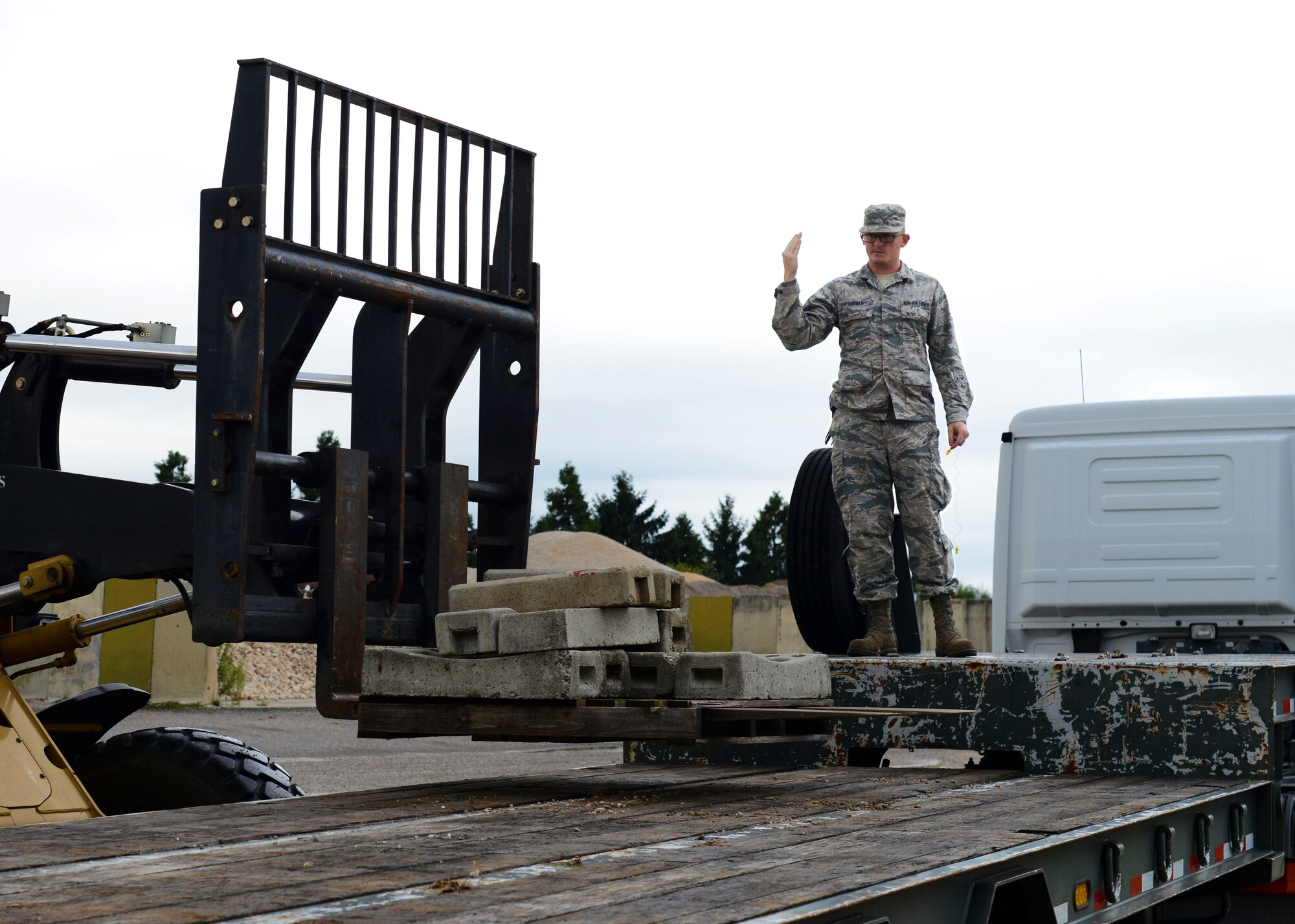 U.S. Air Force Senior Airman Joseph Garber, 31st Civil Engineer Squadron payments and equipment journeyman, guides a 10k all-terrain forklift during a monthly prime base engineer emergency force, or Prime BEEF, training exercise, Aug. 25, 2015, at Aviano Air Base, Italy. After receiving forklift training, participants are qualified to use the equipment instead of relying on another flight to provide assistance. (U.S. Air Force photo by Senior Airman Austin Harvill/Released)