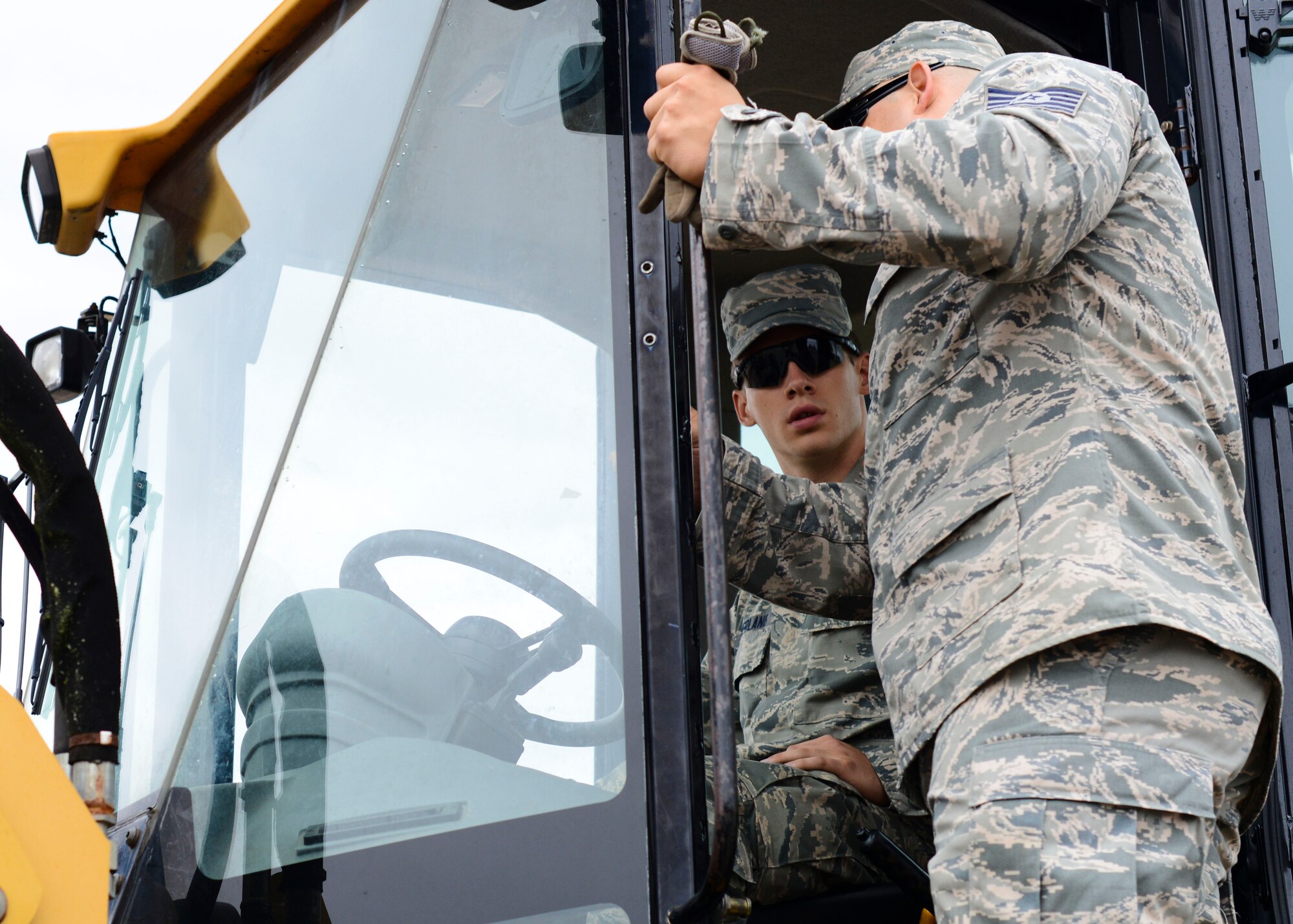 U.S. Air Force Airman 1st Class Seth Netherland, 31st Civil Engineer Squadron explosive ordnance disposal apprentice, listens to instructions during a monthly prime base engineer emergency force, or Prime BEEF, training exercise, Aug. 25, 2015, at Aviano Air Base, Italy. After receiving forklift training, participants are qualified to use the equipment instead of relying on another flight to provide assistance. (U.S. Air Force photo by Senior Airman Austin Harvill/Released)
