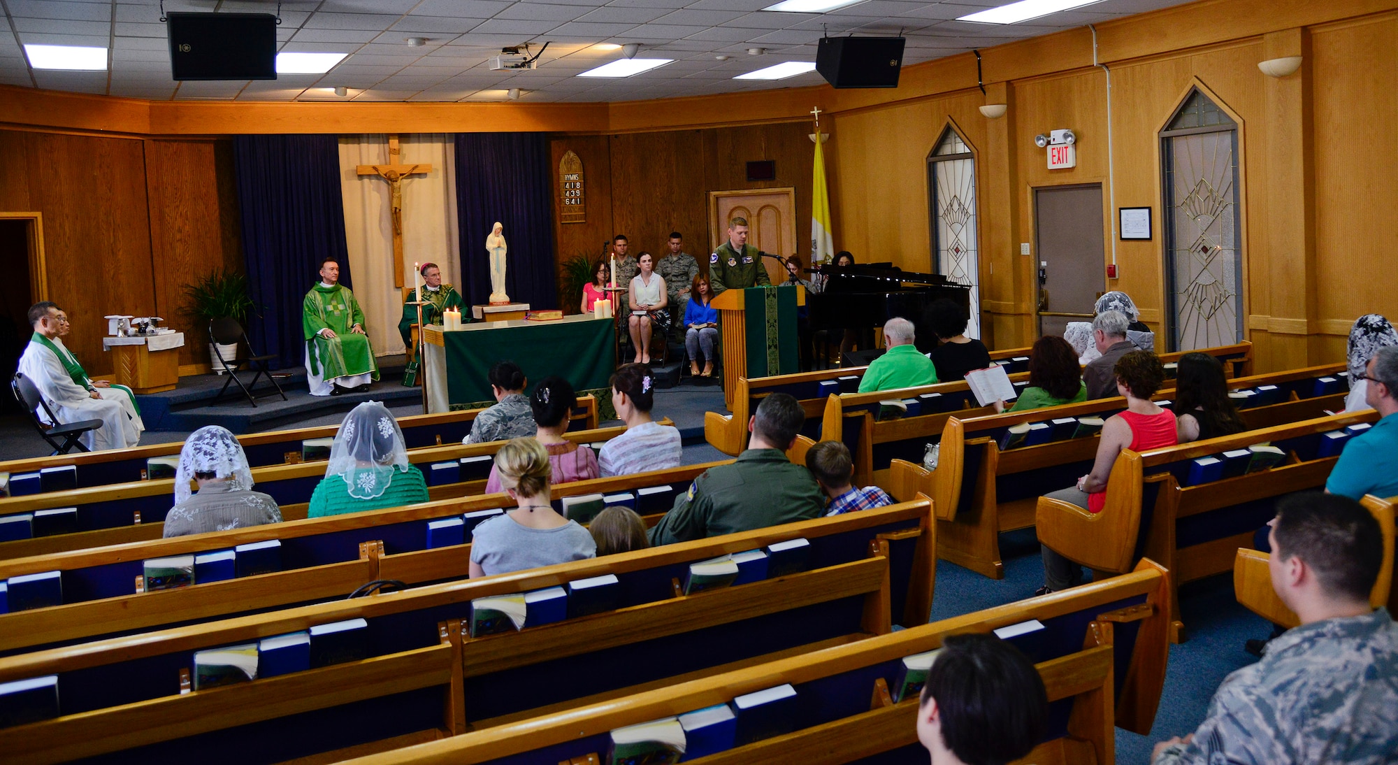 Team Osan members gather for Mass with Archbishop Timothy Broglio, Archbishop of the Military Services, in the chapel on Osan Air Base, Republic of Korea, Aug. 28, 2015. The Archdiocese for the Military Services is responsible for more than 1.8 million men, women, and children world-wide, including more than 220 installations in 29 countries, patients in 153 Veteran Affairs Medical Centers, and federal employees serving outside the boundaries of the U.S. in 134 countries. The AMS ensures they are provided the Roman Catholic Church's full range of pastoral ministries and spiritual services. (U.S. Air Force photo/Senior Airman Kristin High)
