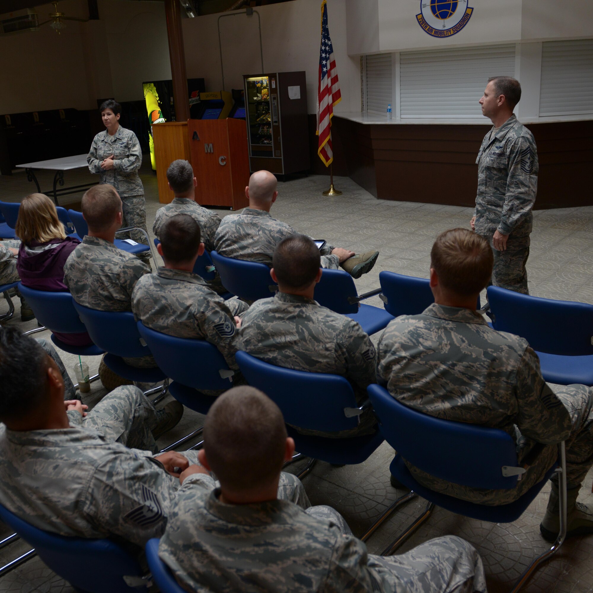 Col. Nancy Bozzer, 521st Air Mobility Operations Wing commander, and Chief Master Sgt. Mark Redden, 521st AMOW command chief, speak with Airmen of the 728th Air Mobility Squadron during an all-call Aug. 24, 2015, at Incirlik Air Base, Turkey. During their visit, Bozzer and Redden toured 728th AMS facilities interacted with Airmen throughout the day. The 728th AMS is a tenant unit at Incirlik and falls under the command of the 521st AMOW. (U.S. Air Force photo by Senior Airman Krystal Ardrey/Released)