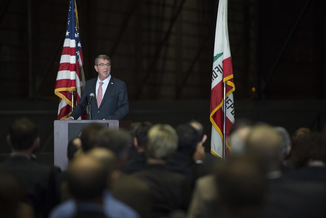 Defense Secretary Ash Carter announces the creation of a National Manufacturing Innovation Institute to produce hybrid electronics during a speech at the National Full Scale Aerodynamics Complex on Moffett Federal Airfield, Calif., Aug. 28, 2015. DoD photo by U.S. Air Force Master Sgt. Adrian Cadiz 