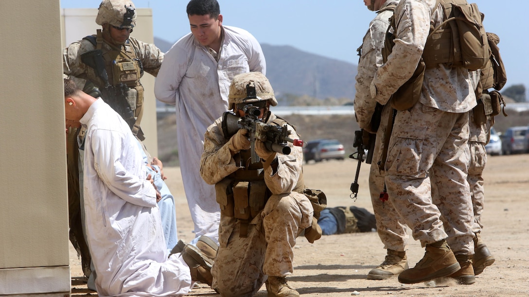Marines with Company A, 1st Battalion, 1st Marine Regiment, 1st Marine Division, conducted a raid demonstration in a simulated town and practiced the proper procedures of apprehending detainees during an amphibious raid demonstration in conjunction with a visit from the secretary of defense, aboard Marine Corps Base Camp Pendleton, Calif., Aug. 27, 2015.  The Marines were transported to shore in amphibious assault vehicles with 3d Assault Amphibian Battalion, after exiting the amphibious transport dock ship USS New Orleans (LPD 18) while 3rd Light Armored Reconnaissance Battalion provided additional security.