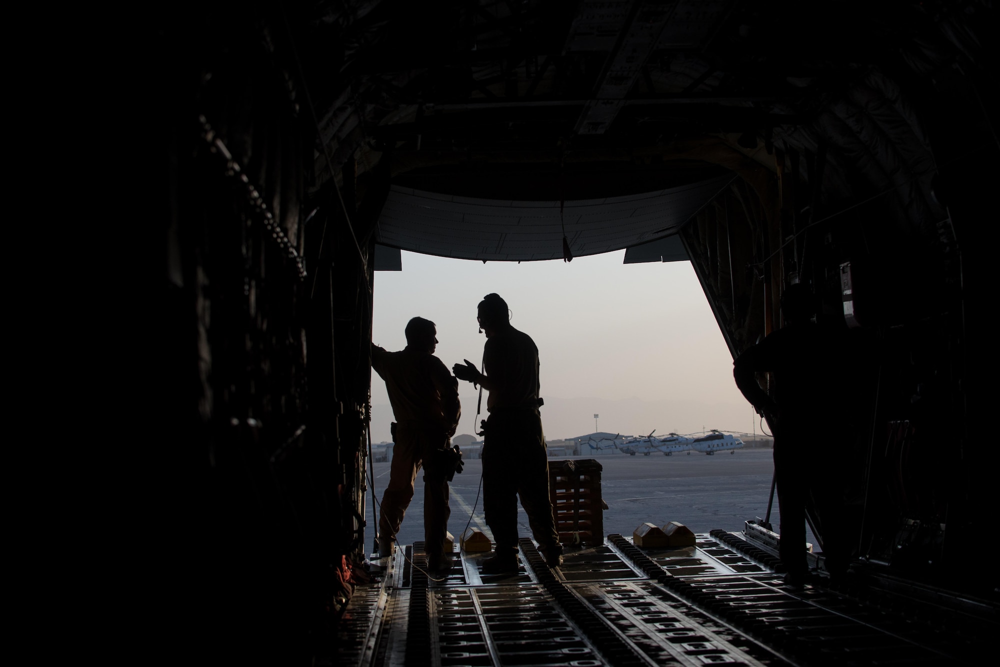 U.S. Airmen assigned to the 455th Air Expeditionary Wing talk before loading cargo onto an Air Force C-130J Super Hercules aircraft at Mazar-e Sharif Airfield, Afghanistan, Aug. 27, 2015. The aircrafts short takeoff and landing capability makes it an optimum fit for Afghanistan’s rugged terrain. (U.S. Air Force photo by Tech. Sgt. Joseph Swafford/Released)