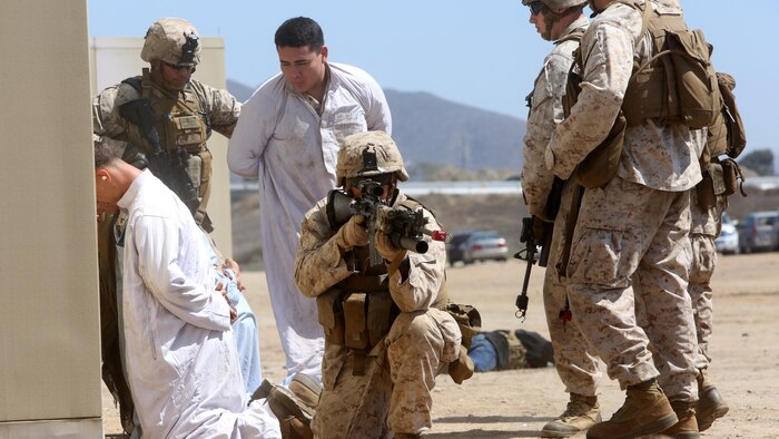 Marines with Company A, 1st Battalion, 1st Marine Regiment, 1st Marine Division, conducted a raid demonstration in a simulated town and practiced the proper procedures of apprehending detainees during an amphibious raid demonstration in conjunction with a visit from the secretary of defense, at Marine Corps Base Camp Pendleton, Calif., Aug. 27, 2015.  The Marines were transported to shore in amphibious assault vehicles with 3d Assault Amphibian Battalion, after exiting the amphibious transport dock ship USS New Orleans (LPD 18) while 3rd Light Armored Reconnaissance Battalion provided additional security.