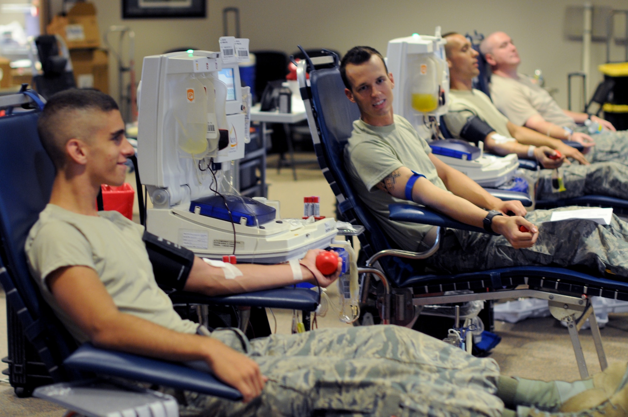 A picture of U.S. Air Force Airman 1st Class Matthew Baruffi, Airman 1st Class Brandon Staines, Senior Airman Ian VanVranken and Tech. Sgt. Gary Apel, all members of the New Jersey Air National Guard's 177th Fighter Wing, relaxing as they give blood during a blood drive.