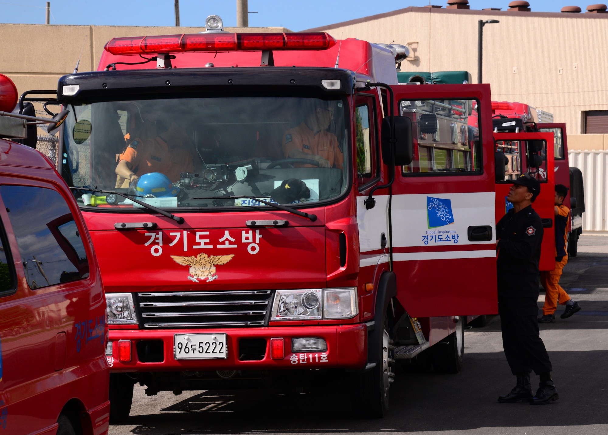 Firefighters from the Songtan fire station prepare for a training event Aug 26, 2015, at Osan Air Base, Republic of Korea. Firefighters from the 51st Civil Engineer Squadron recently hosted a fire-training event and invited the local firefighters to participate. (U. S. Air Force photo by Staff Sgt. Benjamin Sutton)