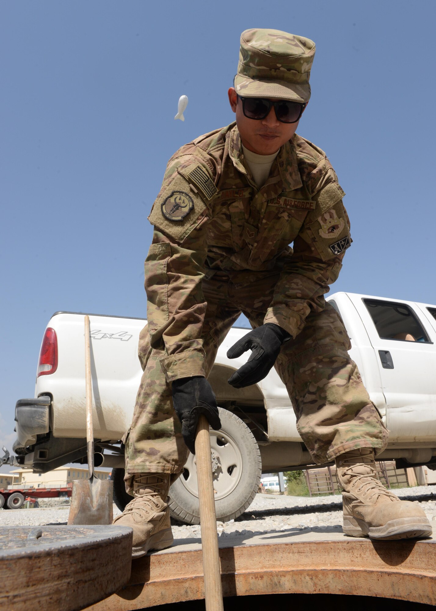 U.S. Air Force Reigel Daylo, 455th Expeditionary Civil Engineer Squadron water and fuel systems maintenance journeyman, checks a water system for debris Aug. 27, 2015, at Bagram Airfield, Afghanistan. Daylo is one of three Airmen responsible for maintaining the fuel line on the airfield as well as quality of life of some living quarters on base and a few facilities that are not yet contracted. (U.S. Air Force photo by Senior Airman Cierra Presentado/Released)