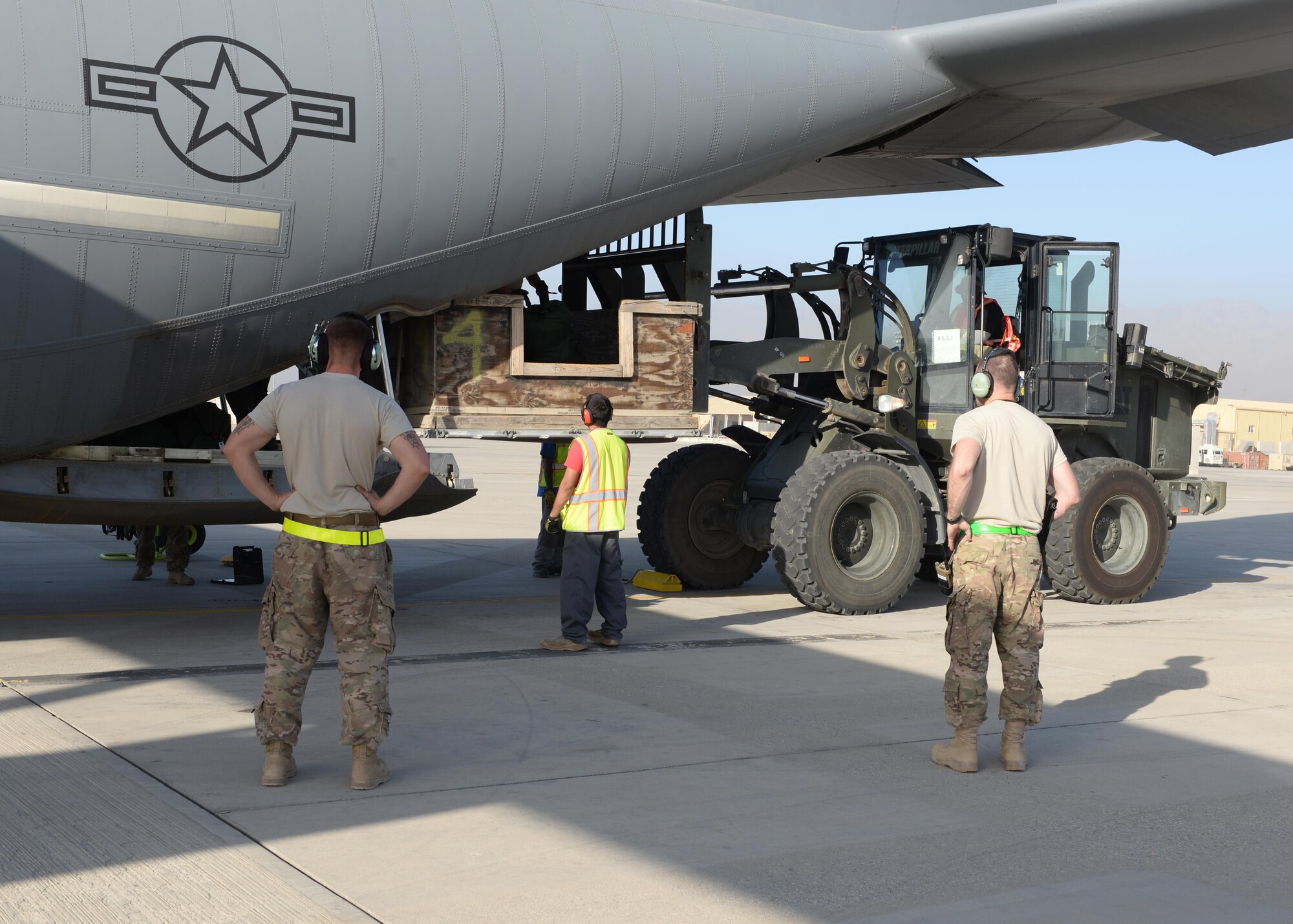 C-130J Super Hercules crew chiefs assist loadmasters with moving cargo onto an aircraft before take-off Aug. 28, 2015, at Bagram Airfield, Afghanistan. Strauss and his fellow loadmasters are responsible for loading and unloading cargo, passenger safety in flight, and ensuring the aircraft stays within the proper weight and balance limitations. (U.S. Air Force photo by Senior Airman Cierra Presentado/Released)