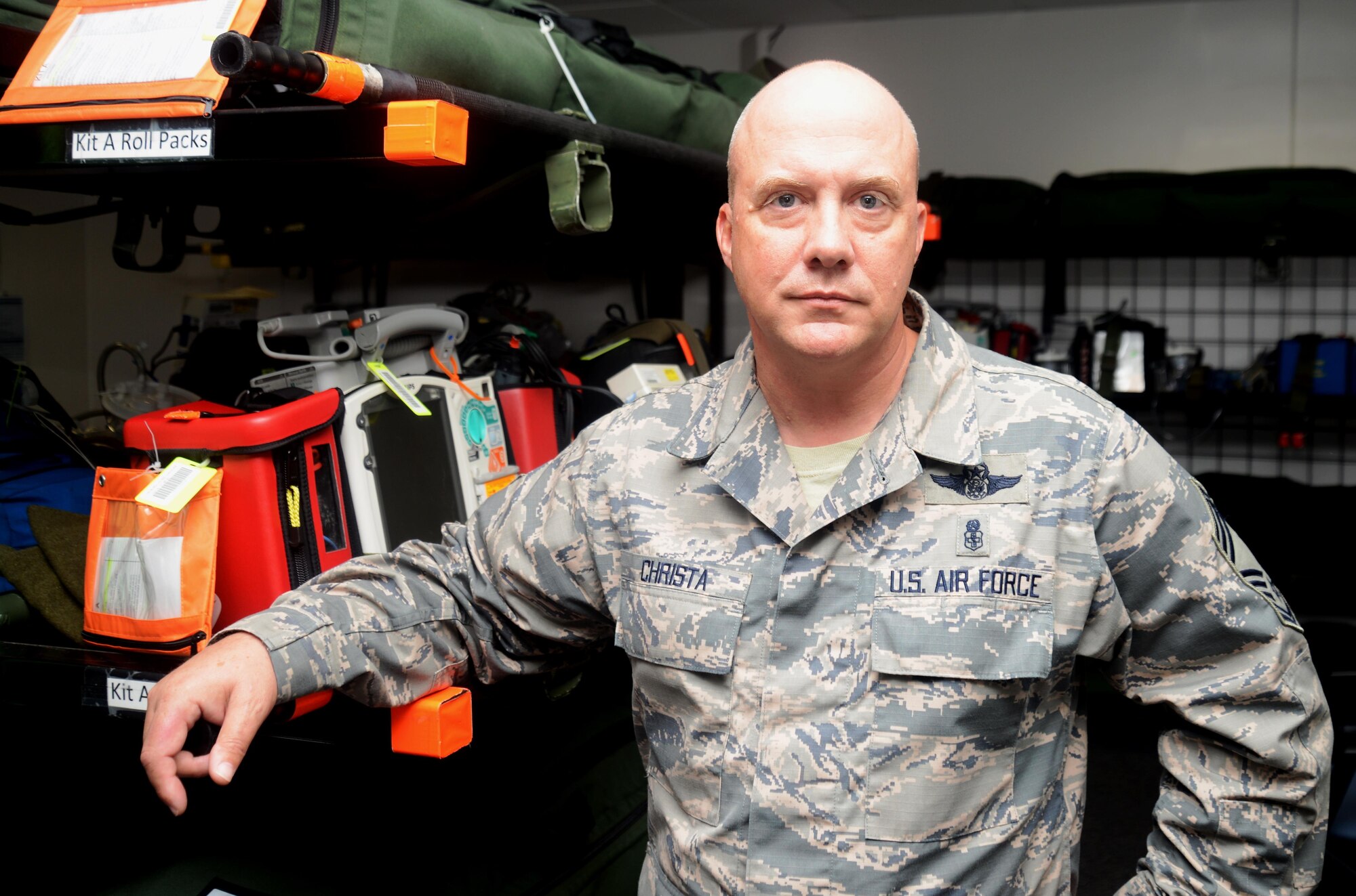 Chief Master Sgt. Rodney Christa, 433rd Aeromedical Evacuation Squadron superintendent, showcases the units medical deployment packages that are used for natural disaster relief. Christa supported the evacuation and transport of evacuees during Hurricane Katrina. (U.S. Air Force photo by Benjamin Faske)