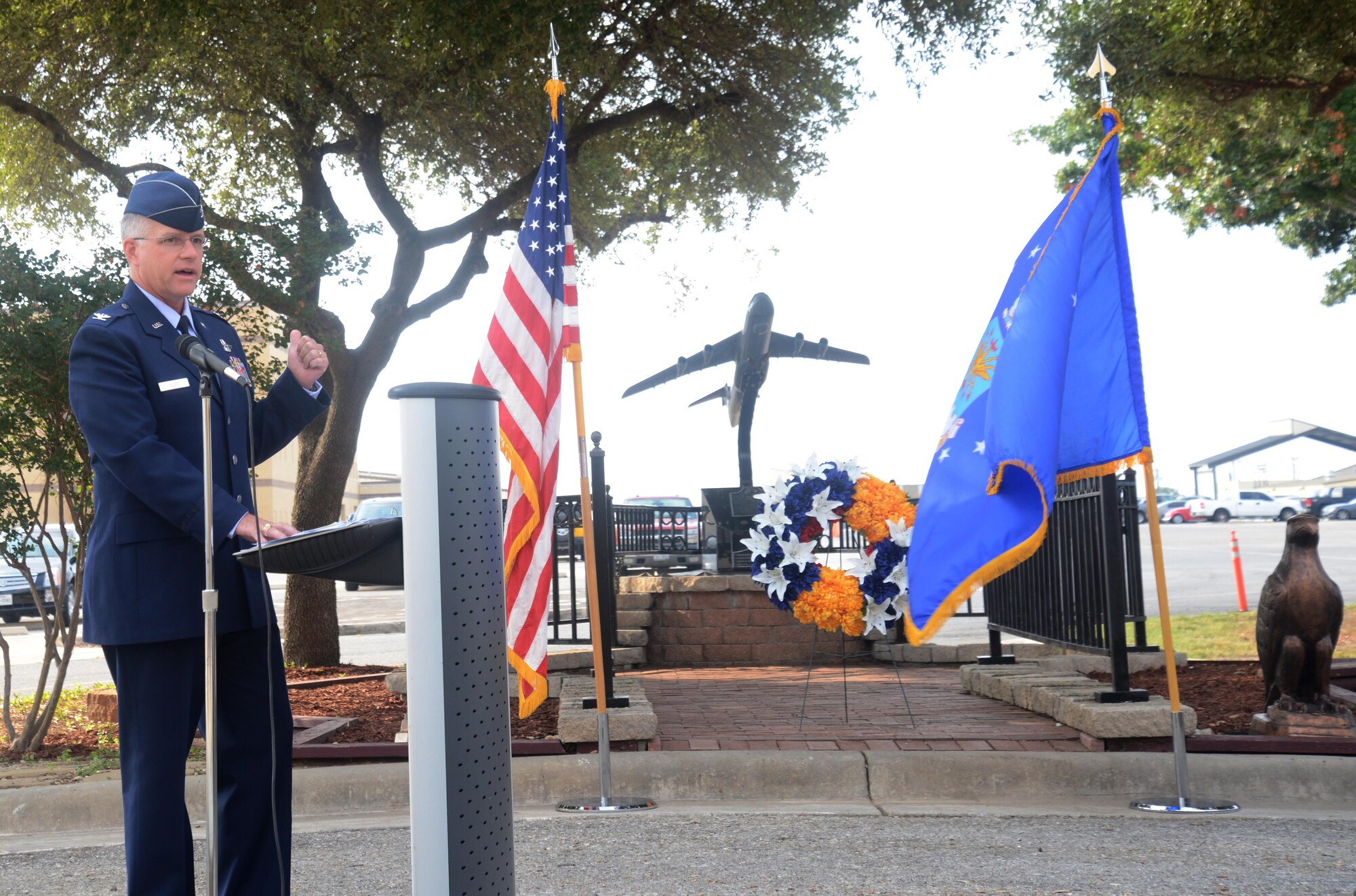 Col. David A. Scott, 433rd Airlift Wing vice commander, speaks at the25th anniversary of the Bravo-12 crash Aug. 27, 2015, at Joint Base San Antonio-Lackland, Texas. Nine 433rd AW crewmembers and four duty passengers paid the ultimate price when their C-5A Galaxy crashed on the outskirts of Ramstein Air Base, Germany during Operation Desert Shield. (U.S. Air Force photo by Benjamin Faske)