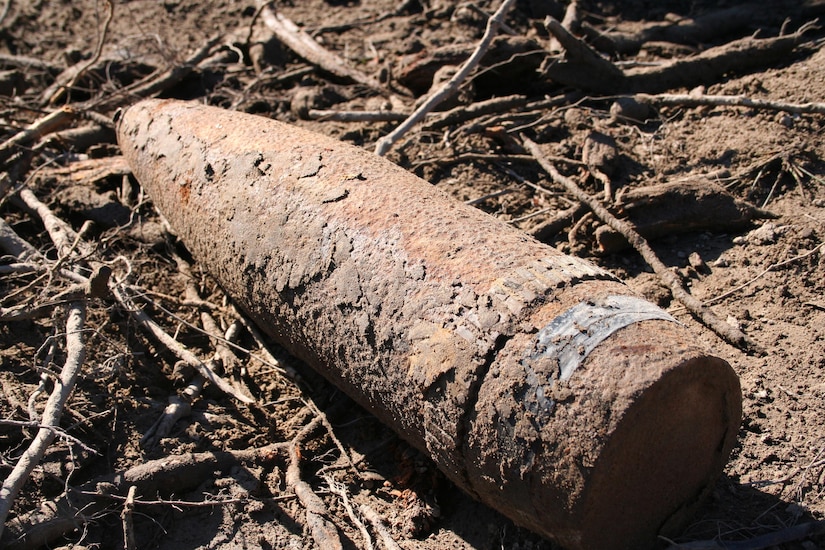 SUFFOLK, Va. -- A munition uncovered by contractors lays on the ground at the Former Nansemond Ordnance Depot on Dec. 2, 2005. In 1987 the Former Nansemond Ordnance Depot  became a matter of public concern when a piece of crystalline TNT was found at the Tidewater Community College, Portsmouth Campus. Extensive historical research, investigations, and testing led the U.S. Environmental Protection Agency to place this site on the National Priority list in 1999. The U.S. Army Corps of Engineers has managed the clean-up project on this site since. (U.S. Army photo/Patrick Bloodgood)