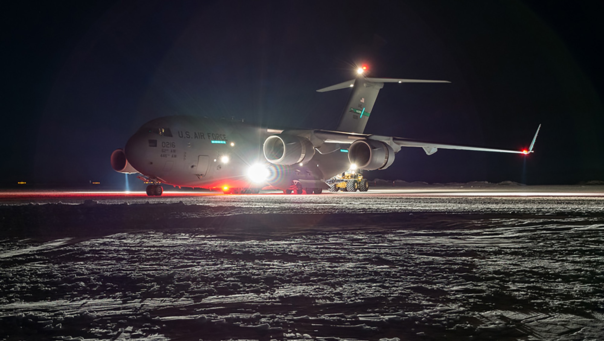 A McChord C-17 on the ice in Antarctica. Night missions to the frozen wasteland are now possible because of night vision equipment aboard the plane. (Photo by Joshua Swanson)
