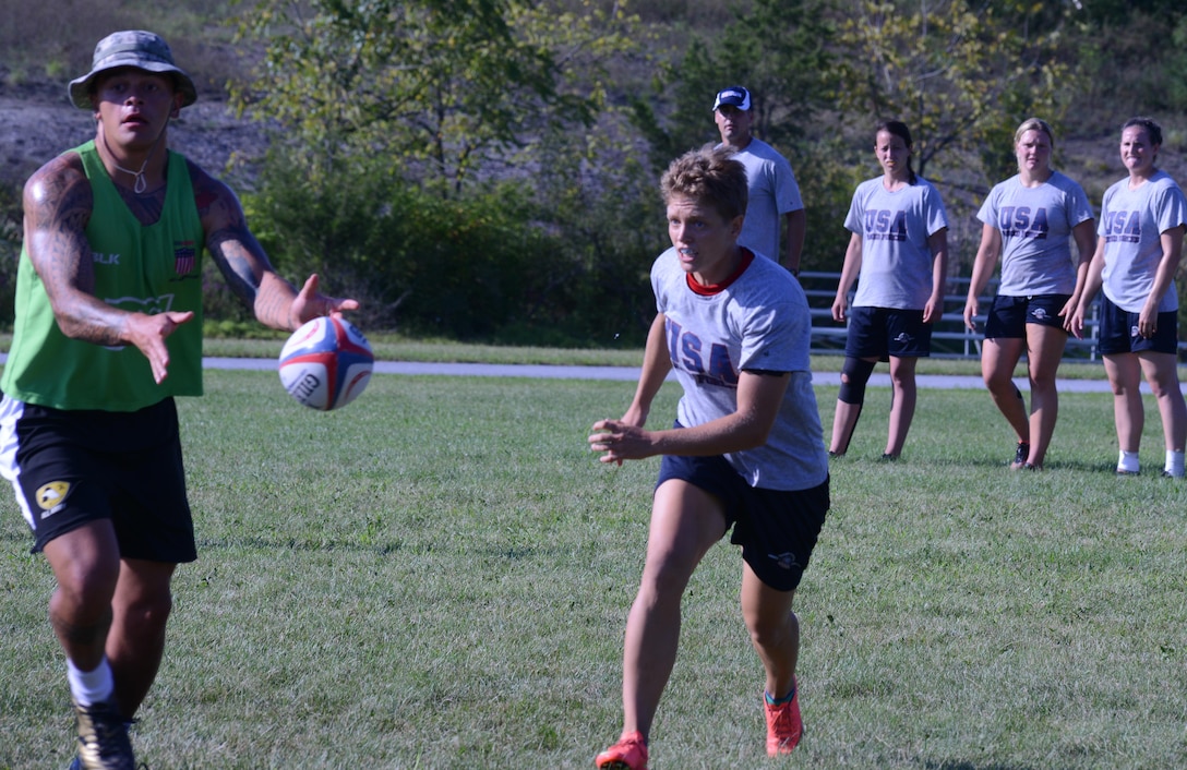 Marine 1st Lt. Jane Paar defends against a member of the Armed Forces Men's Rugby Team during a drill at Fort Indiantown Gap, Pa., Aug. 25, 2015. Paar is captain of the Armed Forces Women's Rugby Team and also plays for the U.S. National Team in San Diego.