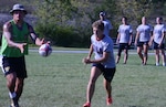 Marine 1st Lt. Jane Paar defends against a member of the Armed Forces Men's Rugby Team during a drill at Fort Indiantown Gap, Pa., Aug. 25, 2015. Paar is captain of the Armed Forces Women's Rugby Team and also plays for the U.S. National Team in San Diego.