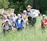 Rock Island District Park Ranger, Tracy Spry, stands with some students attending a Jr. Ranger program at Lake Red Rock in 2014.     