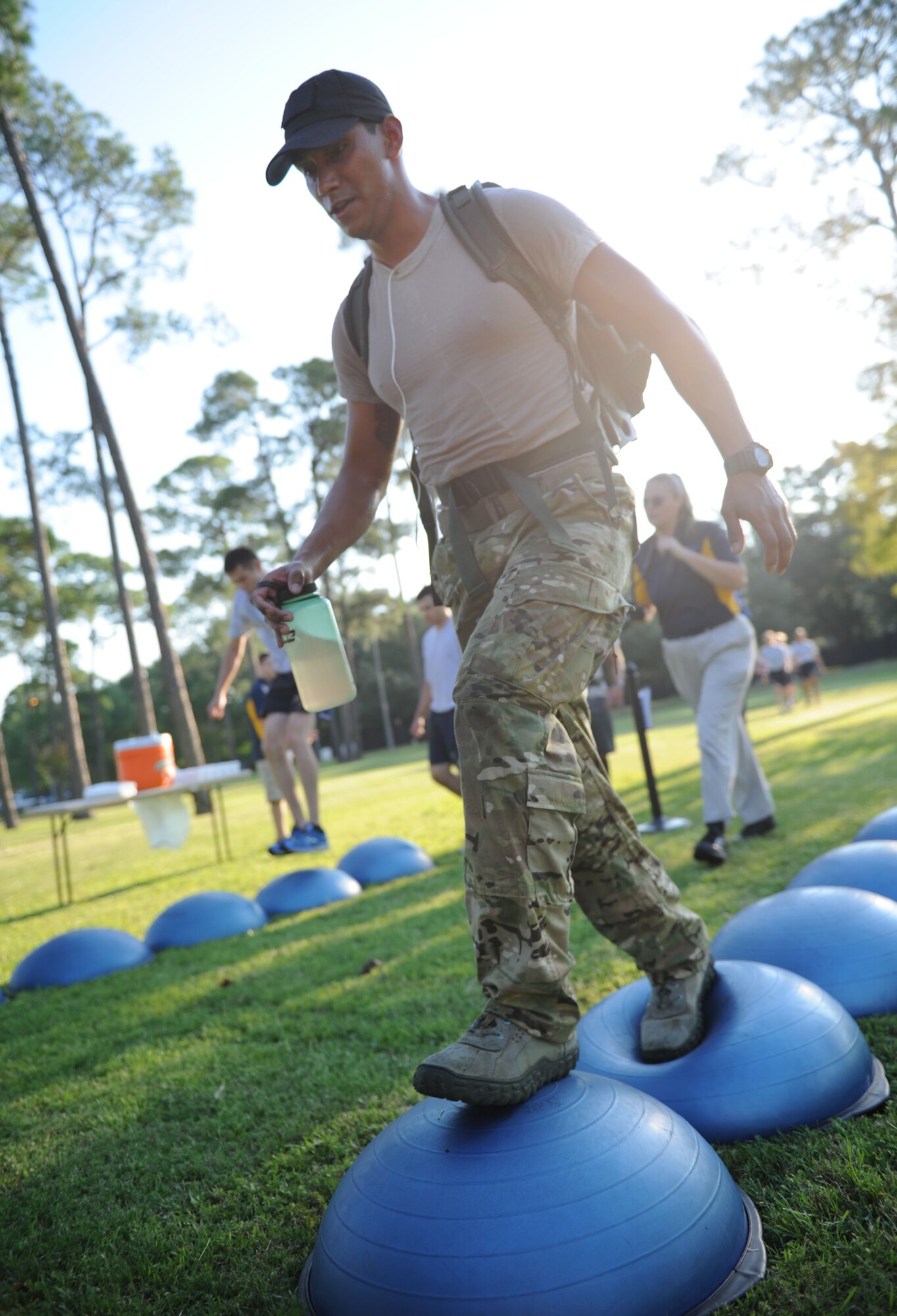 Airman 1st Class Jonathan Villa, 334th Training Squadron student, works his way across a series of BOSU balls during the Gauntlet 5K & Obstacle Course event Aug. 28, 2015, at the Crotwell Track, Keesler Air Force Base, Miss. The 81st Force Support Squadron-sponsored event involved participants completing a 5K run then making their way through nine different obstacles. (U.S. Air Force photo by Kemberly Groue)