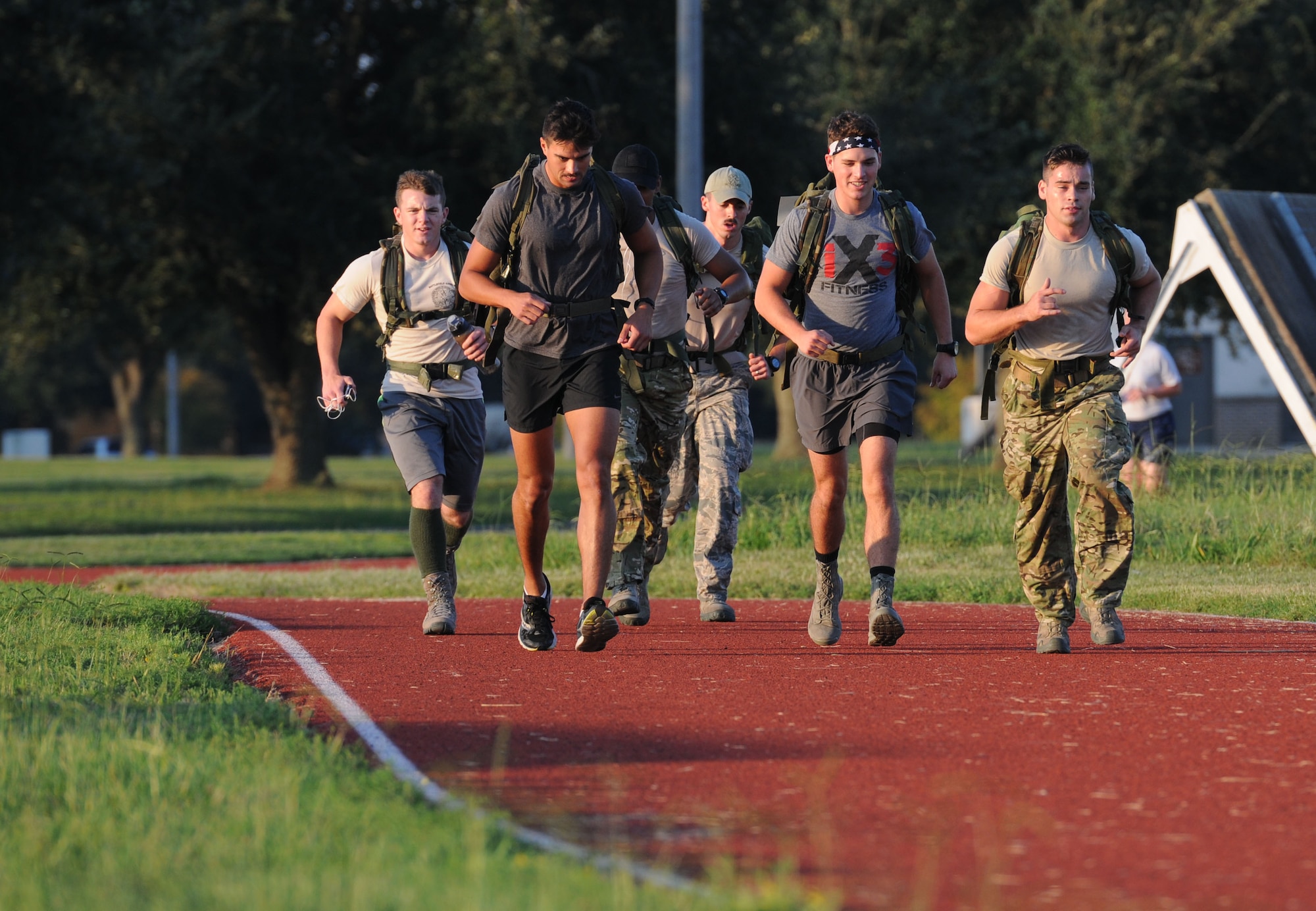 334th Training Squadron Airmen run along the I-81 track during the Gauntlet 5K & Obstacle Course event Aug. 28, 2015, Keesler Air Force Base, Miss. The 81st Force Support Squadron-sponsored event involved participants completing a 5K run then making their way through nine different obstacles. (U.S. Air Force photo by Kemberly Groue)
